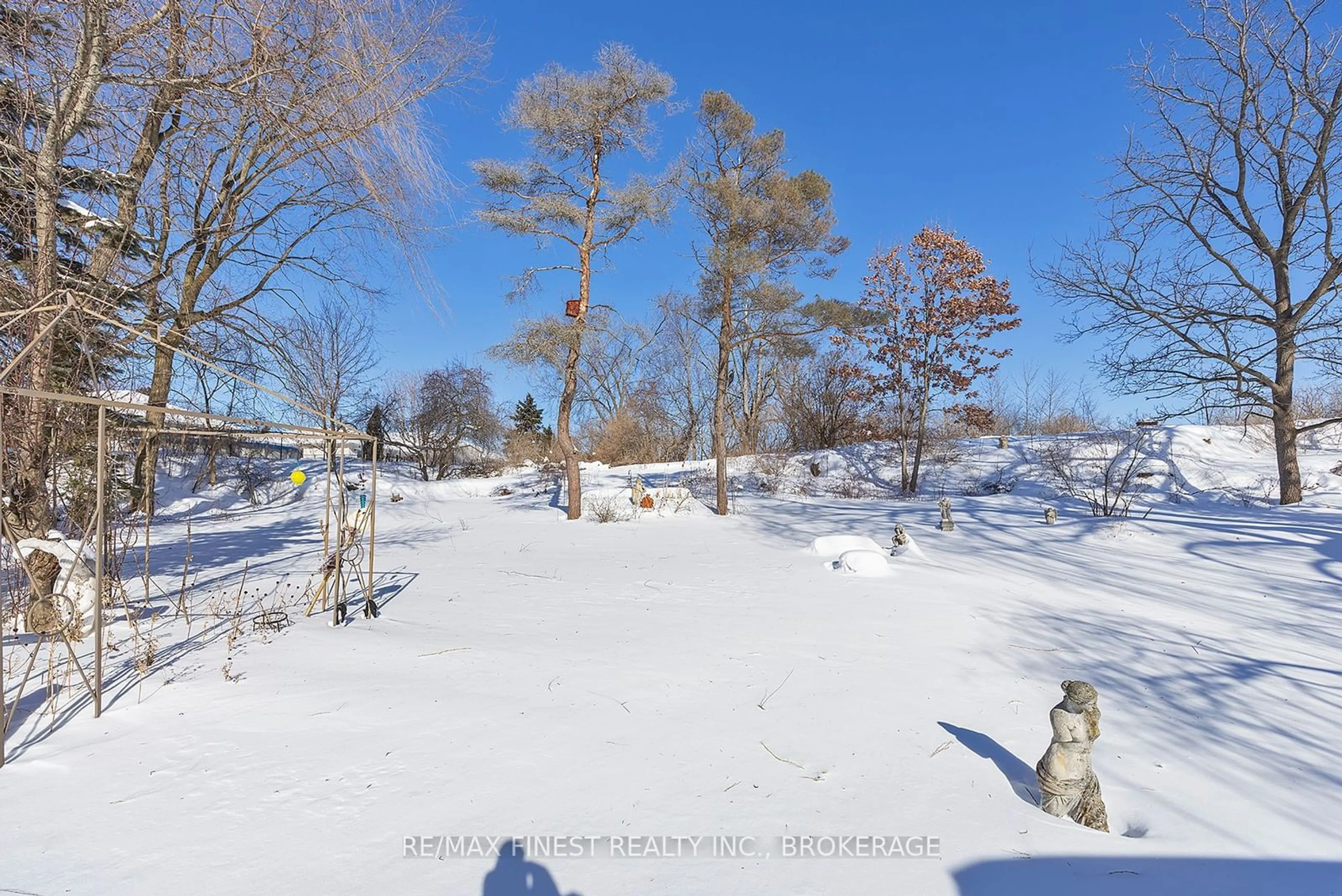 A pic from outside/outdoor area/front of a property/back of a property/a pic from drone, forest/trees view for 640 King St, Gananoque Ontario K7G 2H4