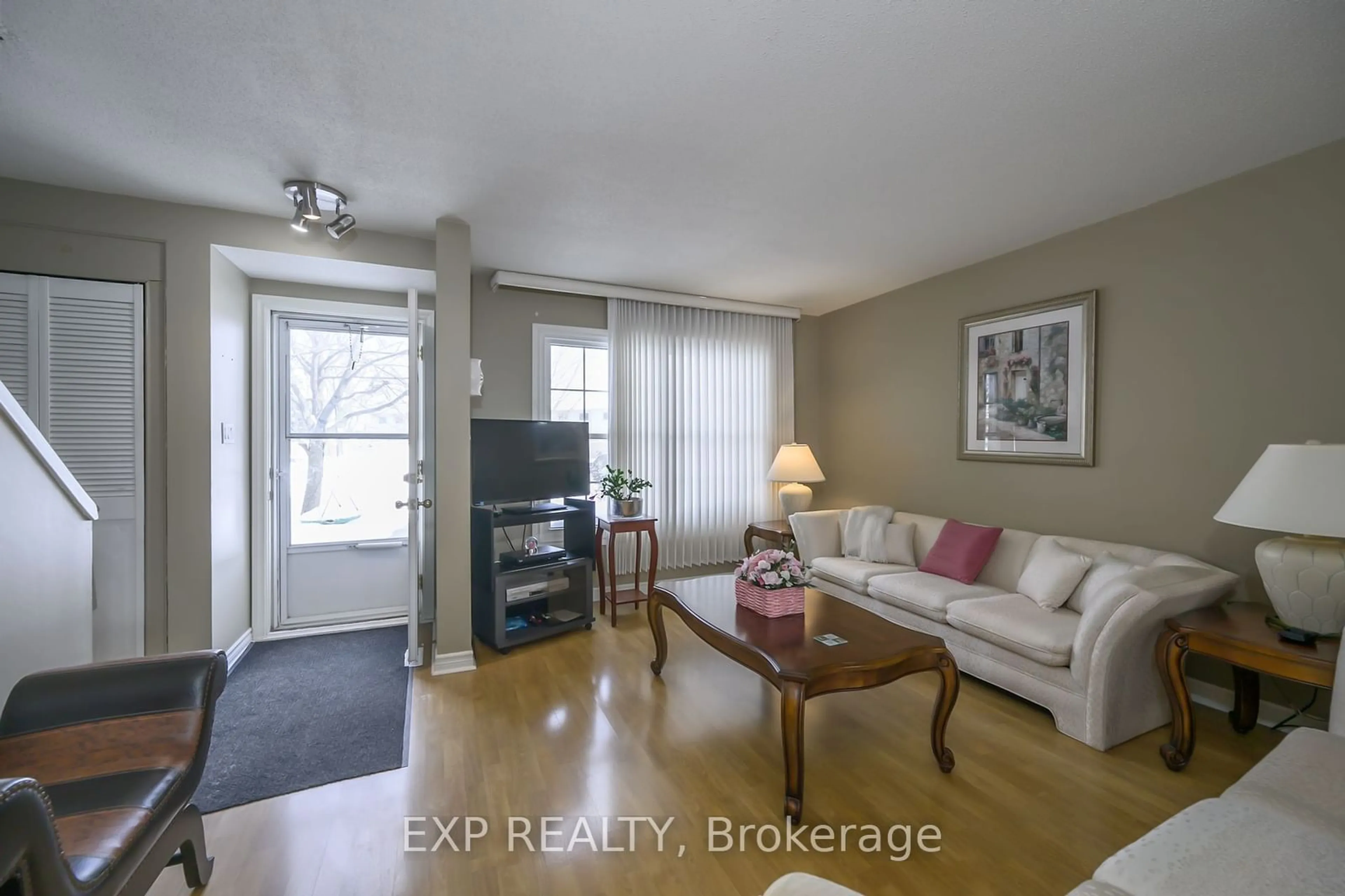 Living room with furniture, wood/laminate floor for 1725 Ernest Ave #64, London Ontario N6E 2W3