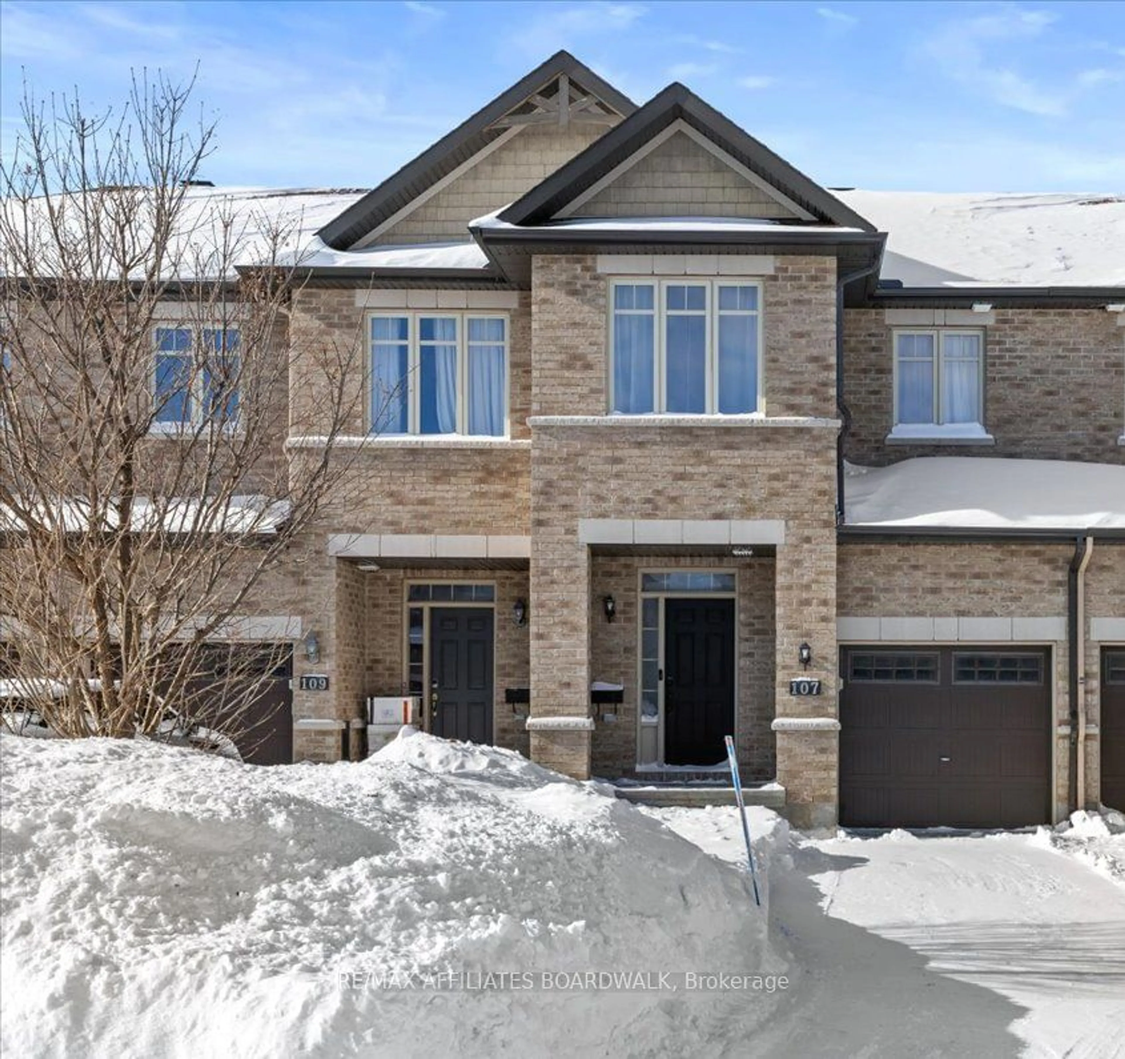 Home with brick exterior material, street for 107 Watchhorn Grve, Ottawa Ontario K1V 2N3