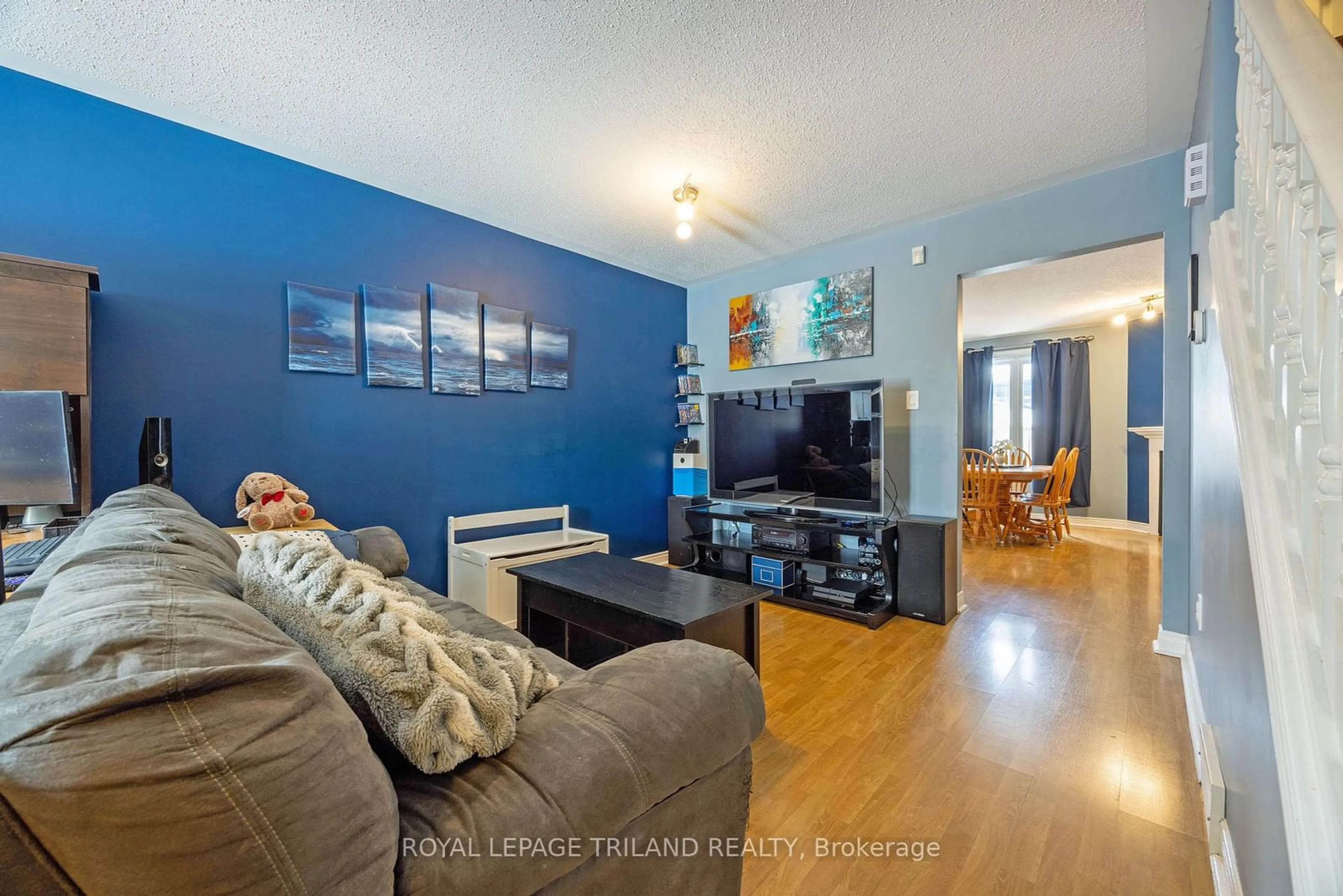 Living room with furniture, wood/laminate floor for 308 Conway Dr #11, London Ontario N6E 3N9