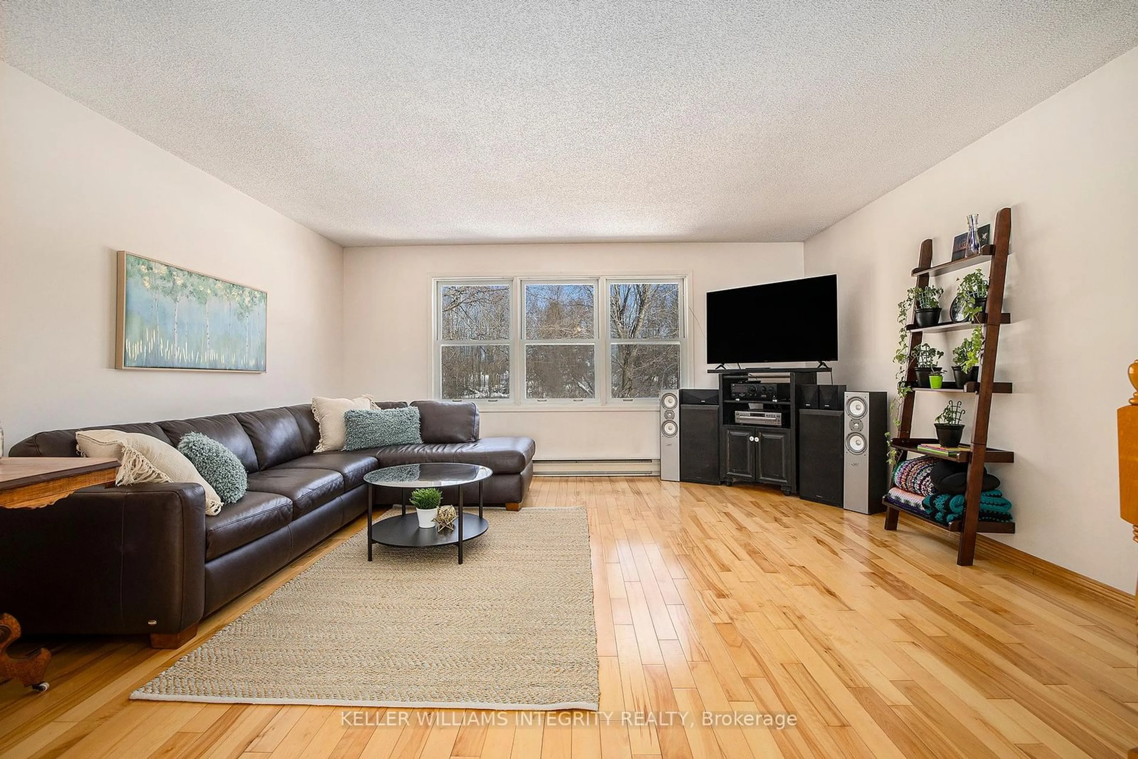 Living room with furniture, wood/laminate floor for 103 Mcveety Rd, Drummond/North Elmsley Ontario K7H 3C7