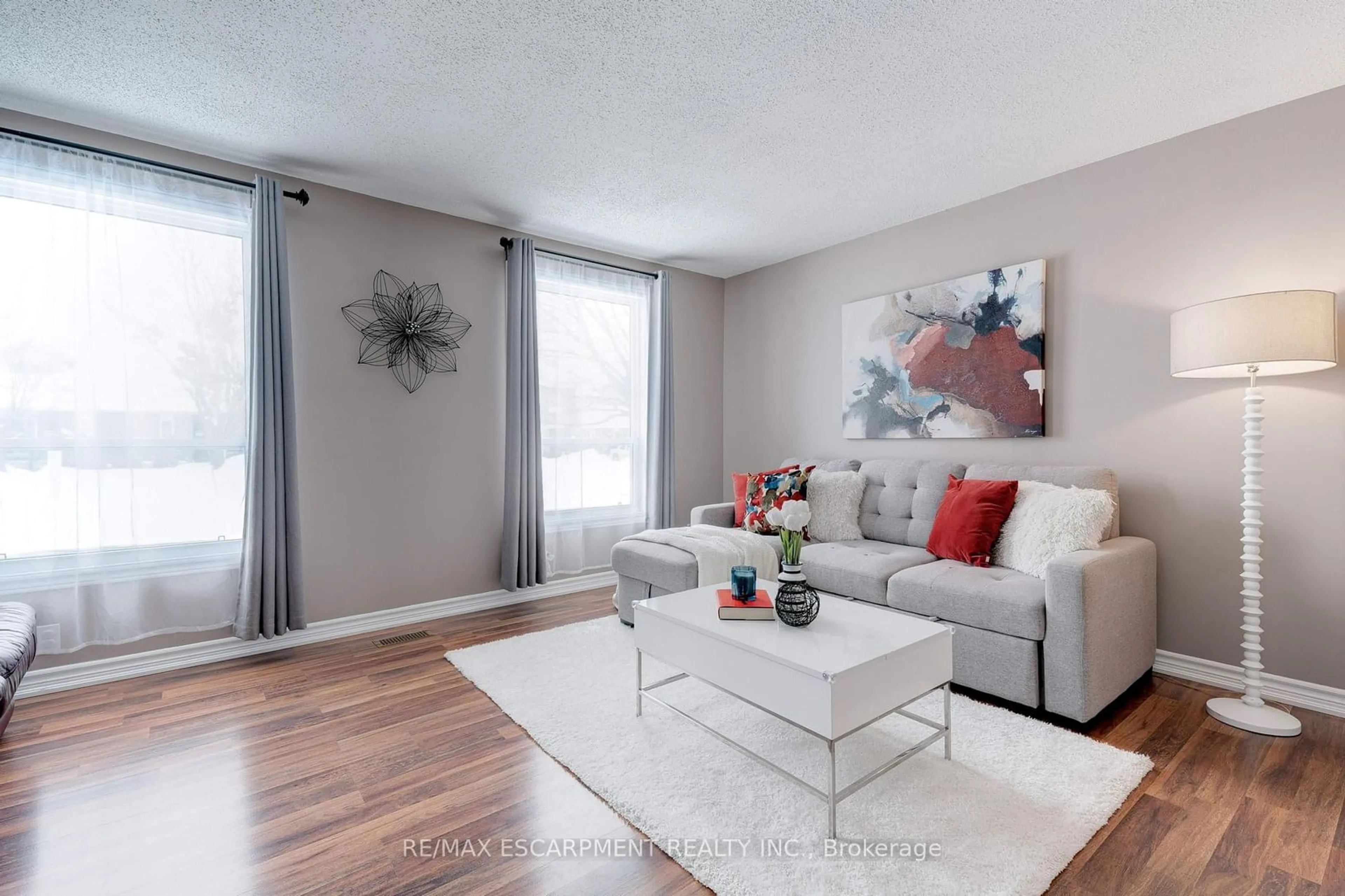 Living room with furniture, wood/laminate floor for 138 Sekura Cres, Cambridge Ontario N1R 7E9