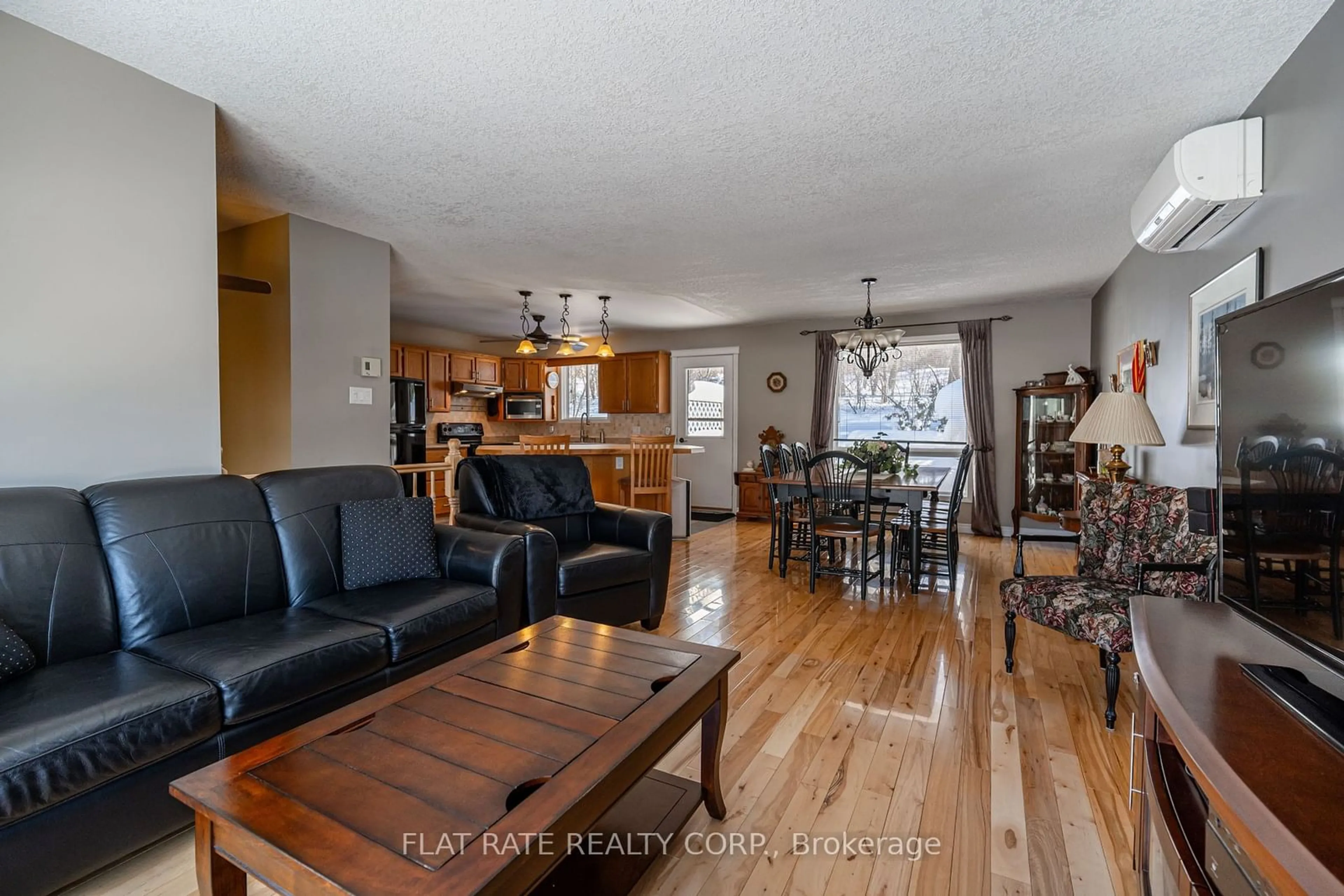 Living room with furniture, wood/laminate floor for 697 PETERBOROUGH Ave, Smith-Ennismore-Lakefield Ontario K0L 1H0