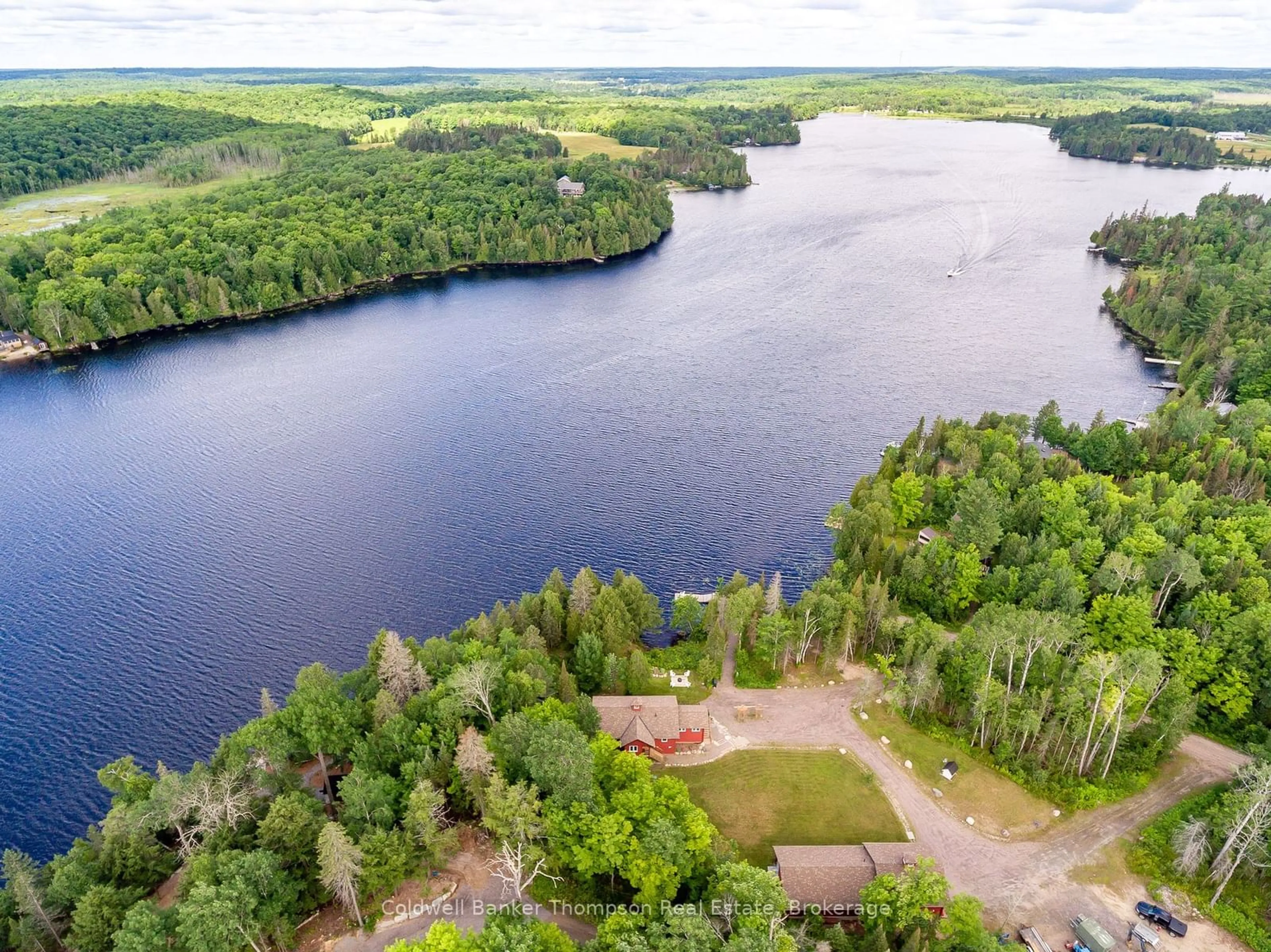 A pic from outside/outdoor area/front of a property/back of a property/a pic from drone, water/lake/river/ocean view for 35 Main Rd, Magnetawan Ontario P0A 1C0