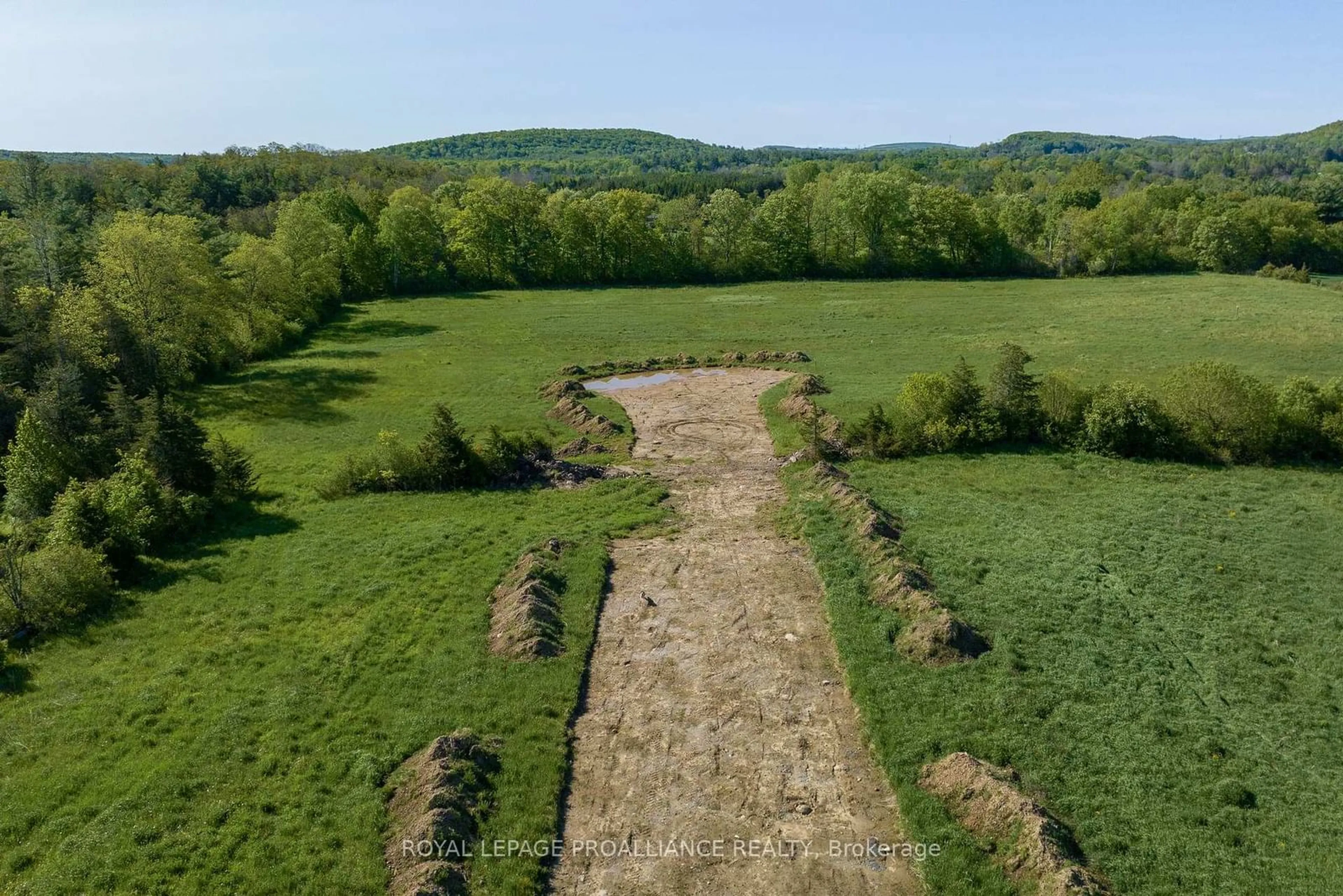 A pic from outside/outdoor area/front of a property/back of a property/a pic from drone, forest/trees view for 18 Berend Crt, Quinte West Ontario K0K 2C0