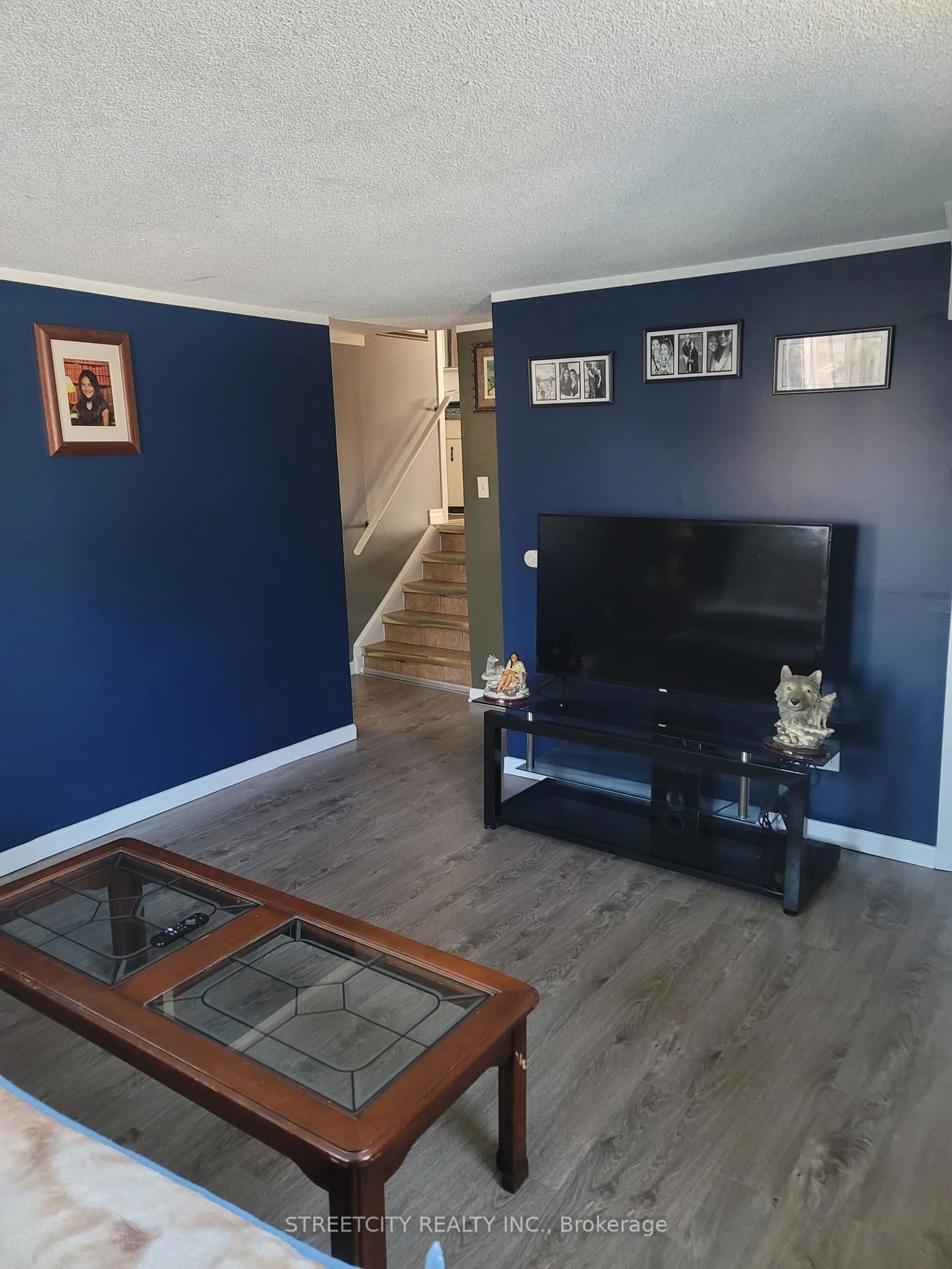 Living room with furniture, wood/laminate floor for 156 Maple St, West Elgin Ontario N0L 2C0