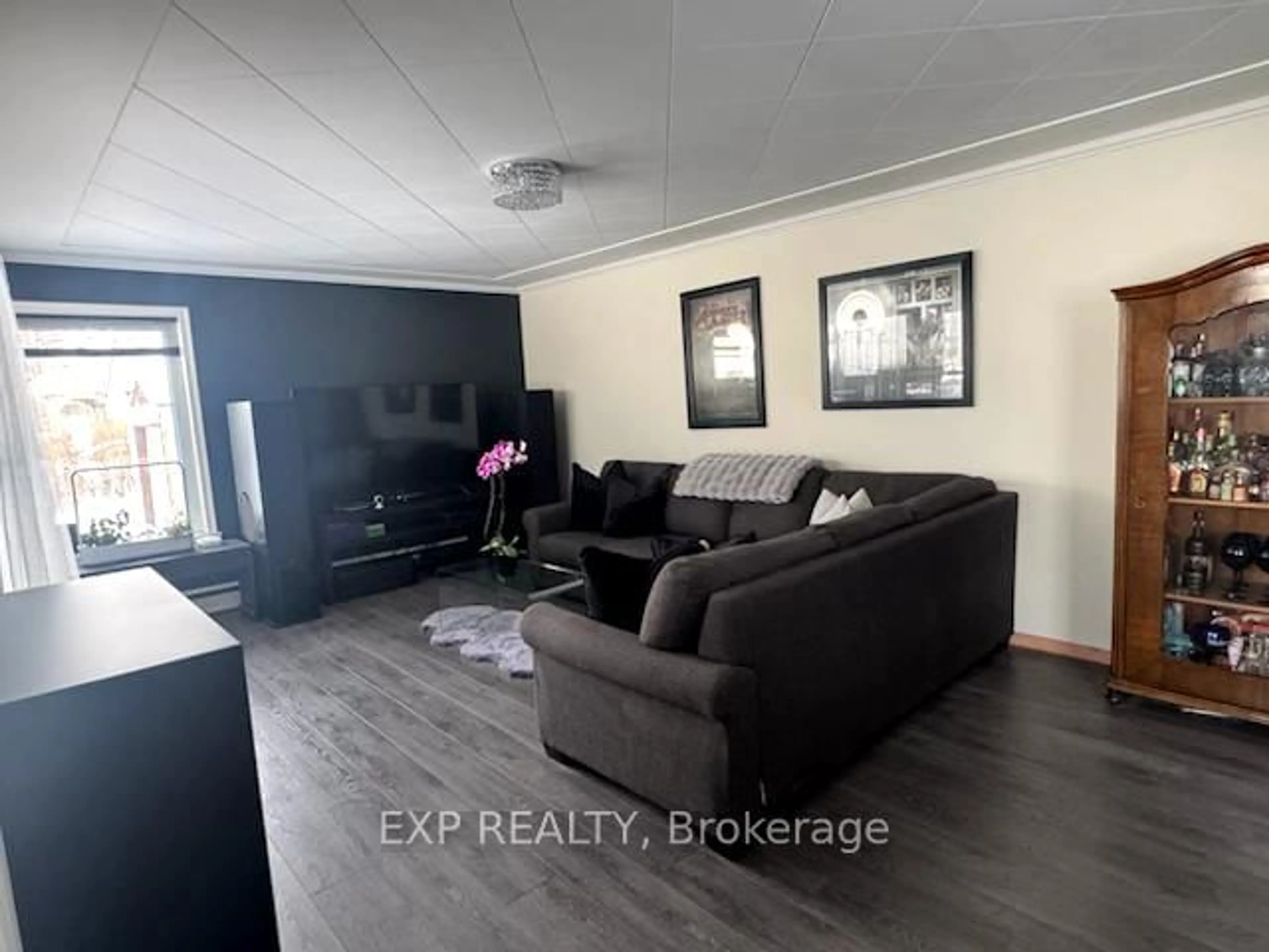 Living room with furniture, wood/laminate floor for 20 Dubeau St, West Nipissing Ontario P0H 2M0