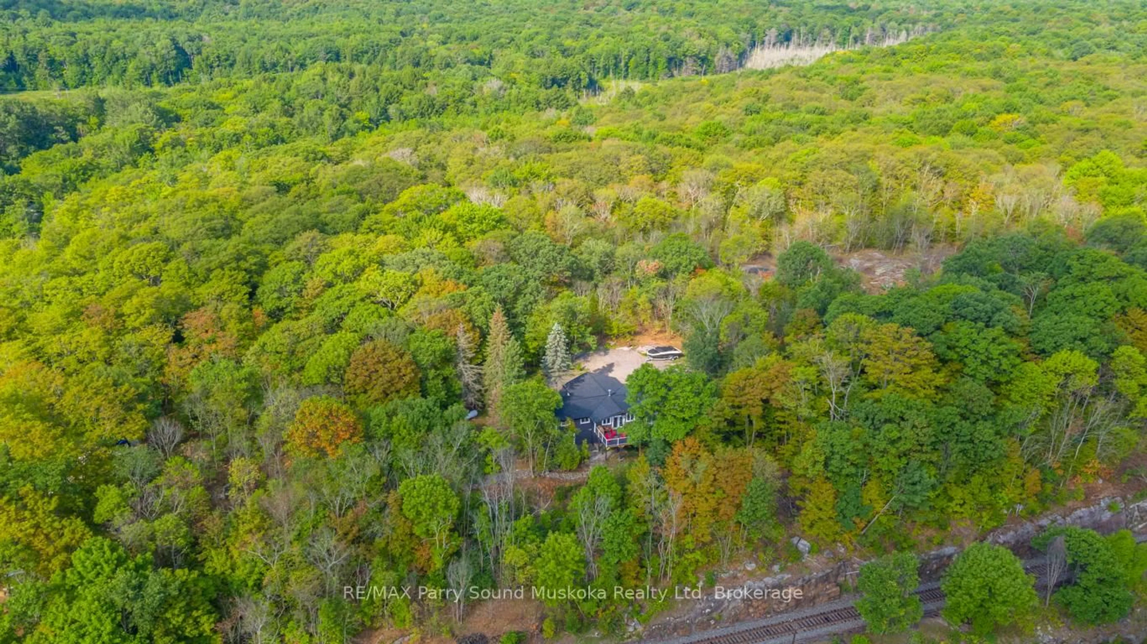 A pic from outside/outdoor area/front of a property/back of a property/a pic from drone, forest/trees view for 143A Highway 612, Seguin Ontario P0C 1H0