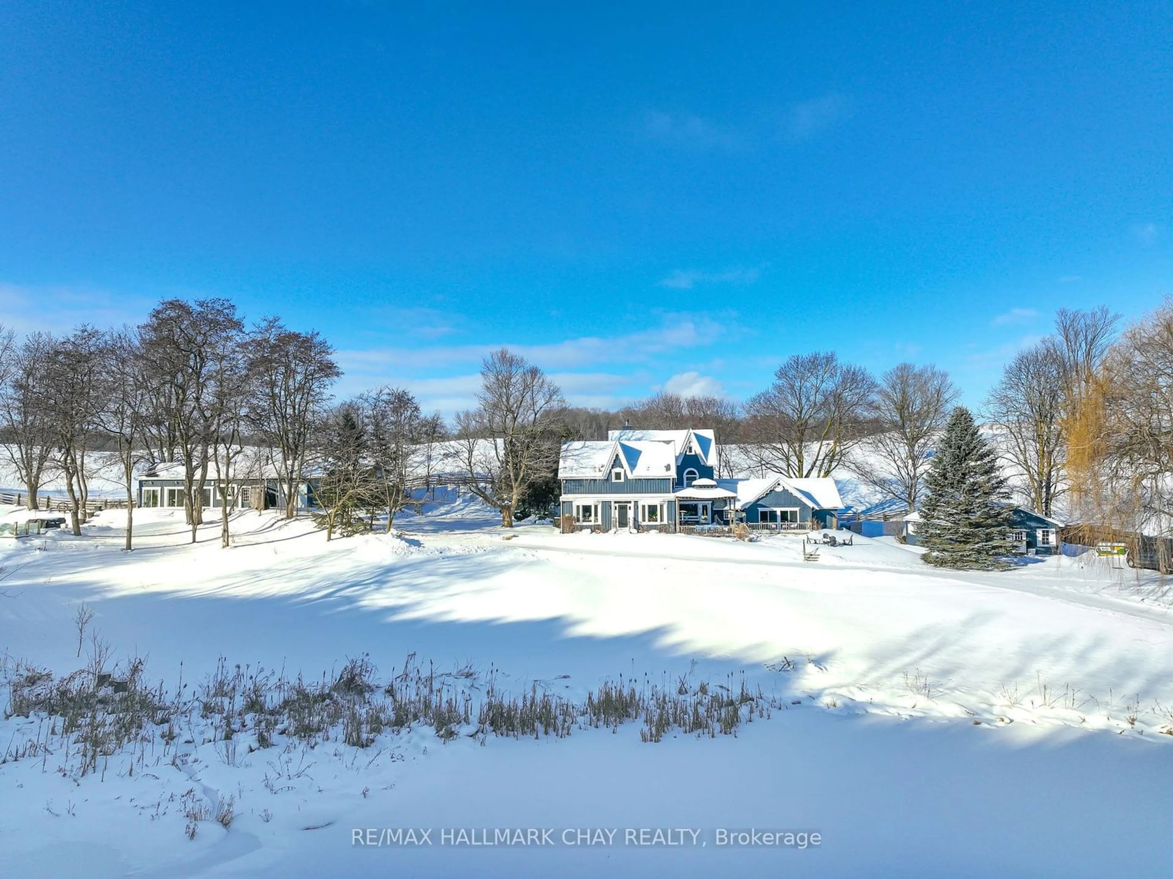 A pic from outside/outdoor area/front of a property/back of a property/a pic from drone, unknown for 876382 5th Line East, Mulmur Ontario L9V 0J9