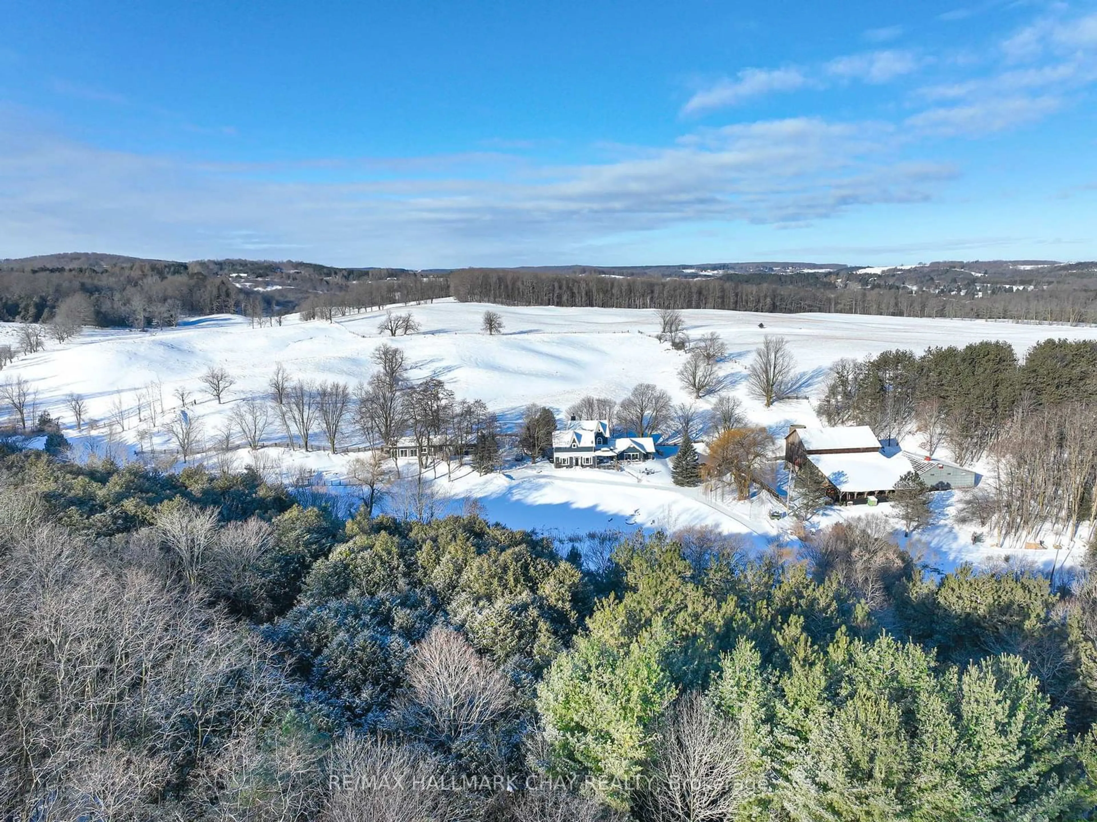 A pic from outside/outdoor area/front of a property/back of a property/a pic from drone, water/lake/river/ocean view for 876382 5th Line East, Mulmur Ontario L9V 0J9