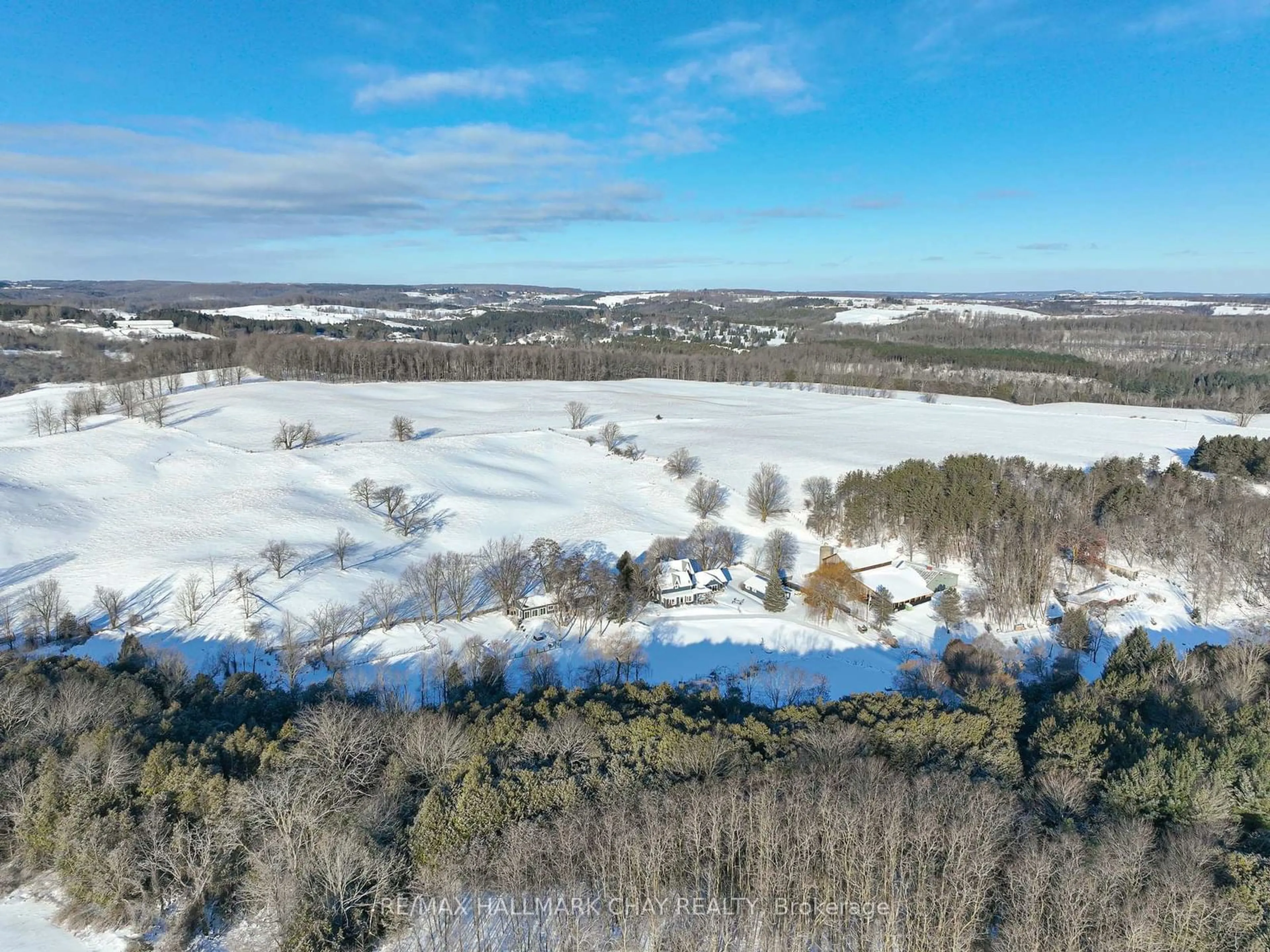 A pic from outside/outdoor area/front of a property/back of a property/a pic from drone, water/lake/river/ocean view for 876382 5th Line East, Mulmur Ontario L9V 0J9