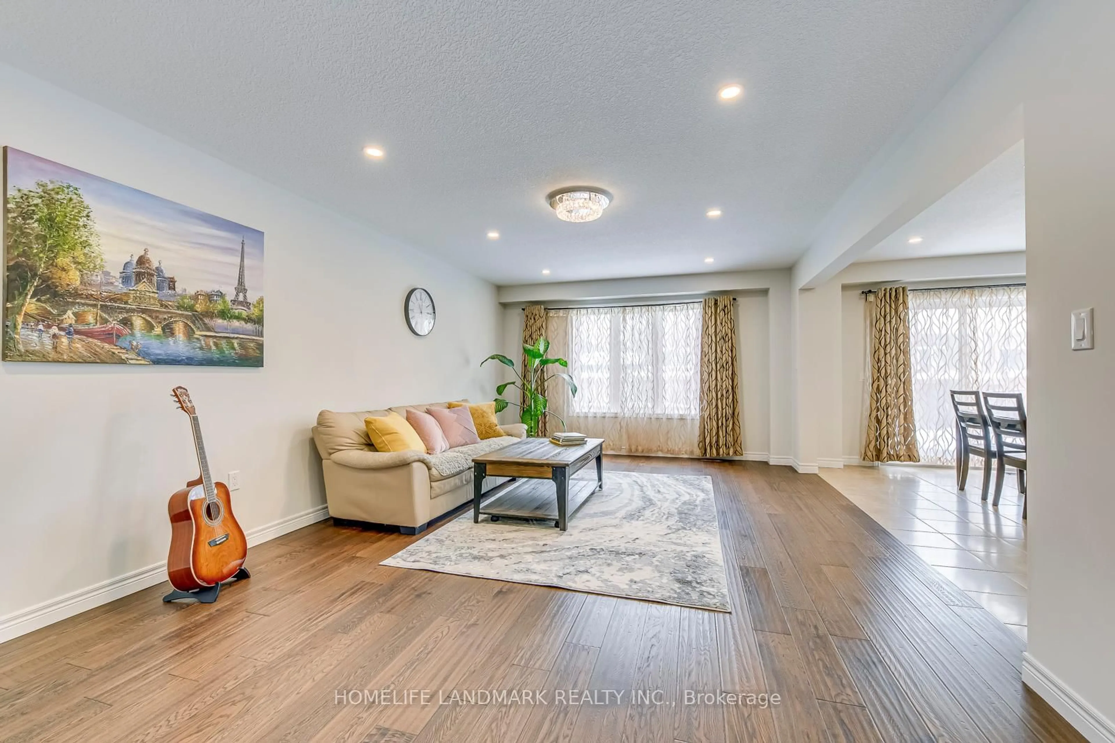 Living room with furniture, wood/laminate floor for 206 Bellagio Ave, Hamilton Ontario L0R 1P0