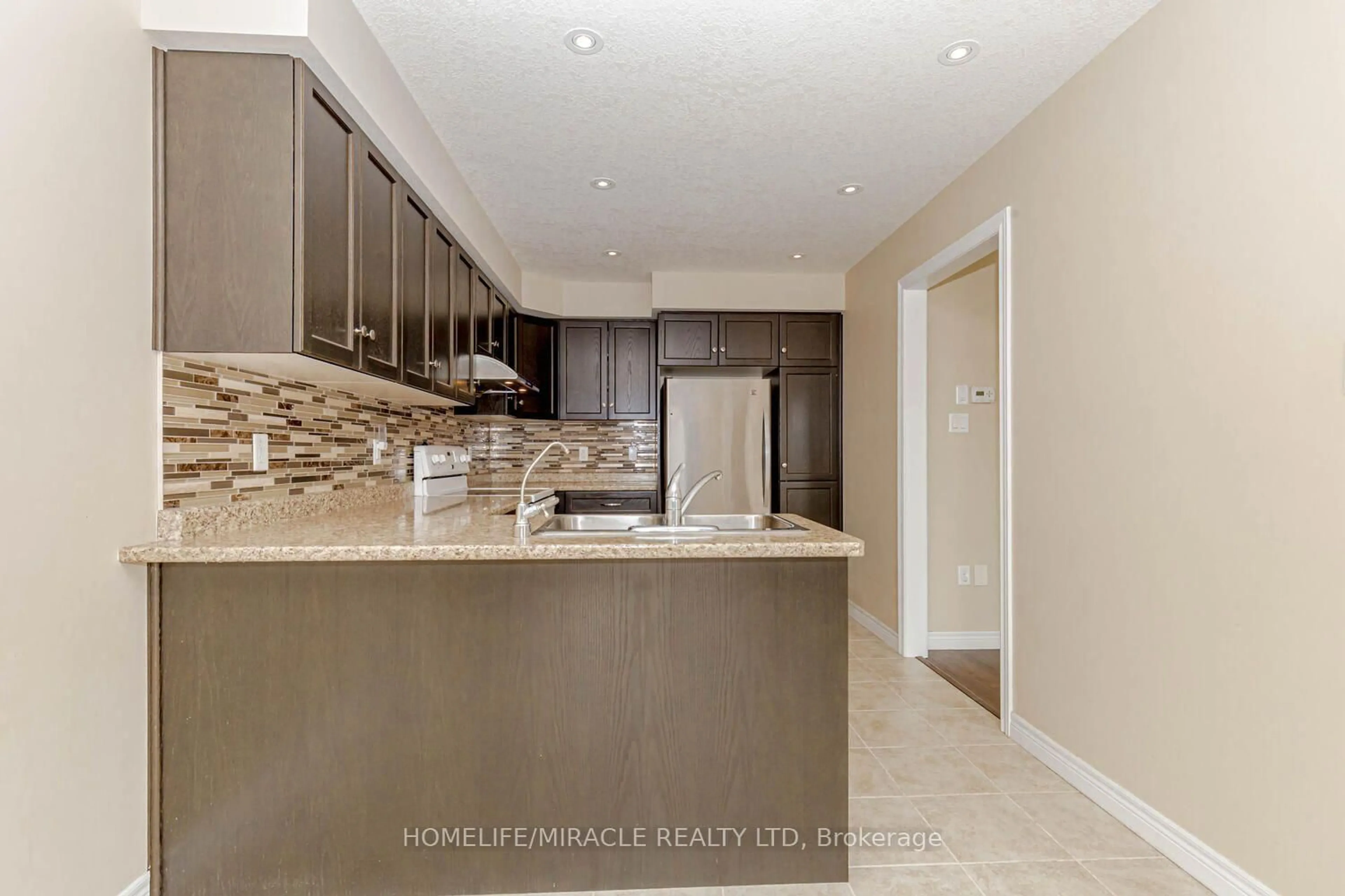 Open concept kitchen, ceramic/tile floor for 83 Oakes Cres, Guelph Ontario N1E 0J5