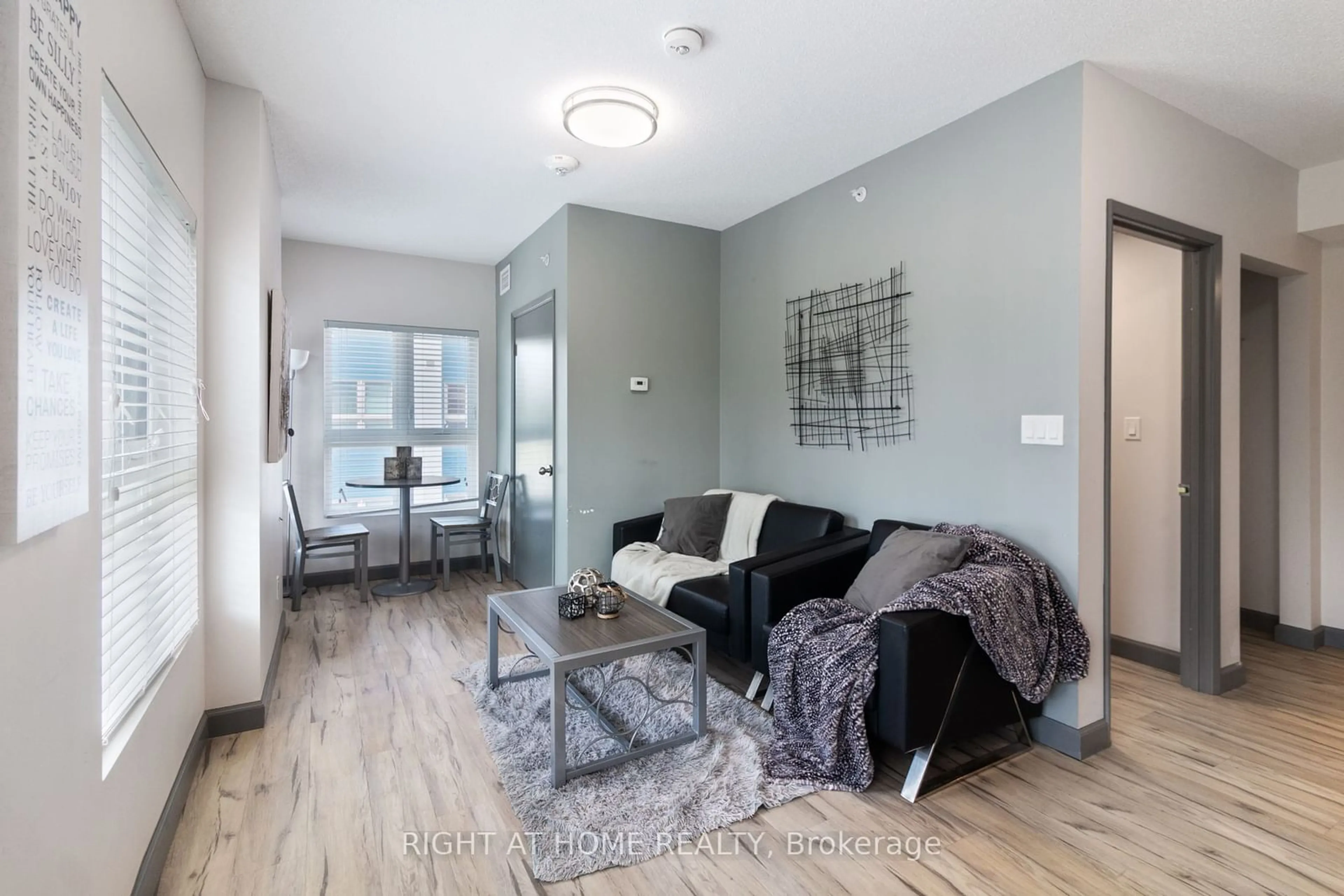 Living room with furniture, wood/laminate floor for 258A SUNVIEW St #156, Waterloo Ontario N2L 0H6