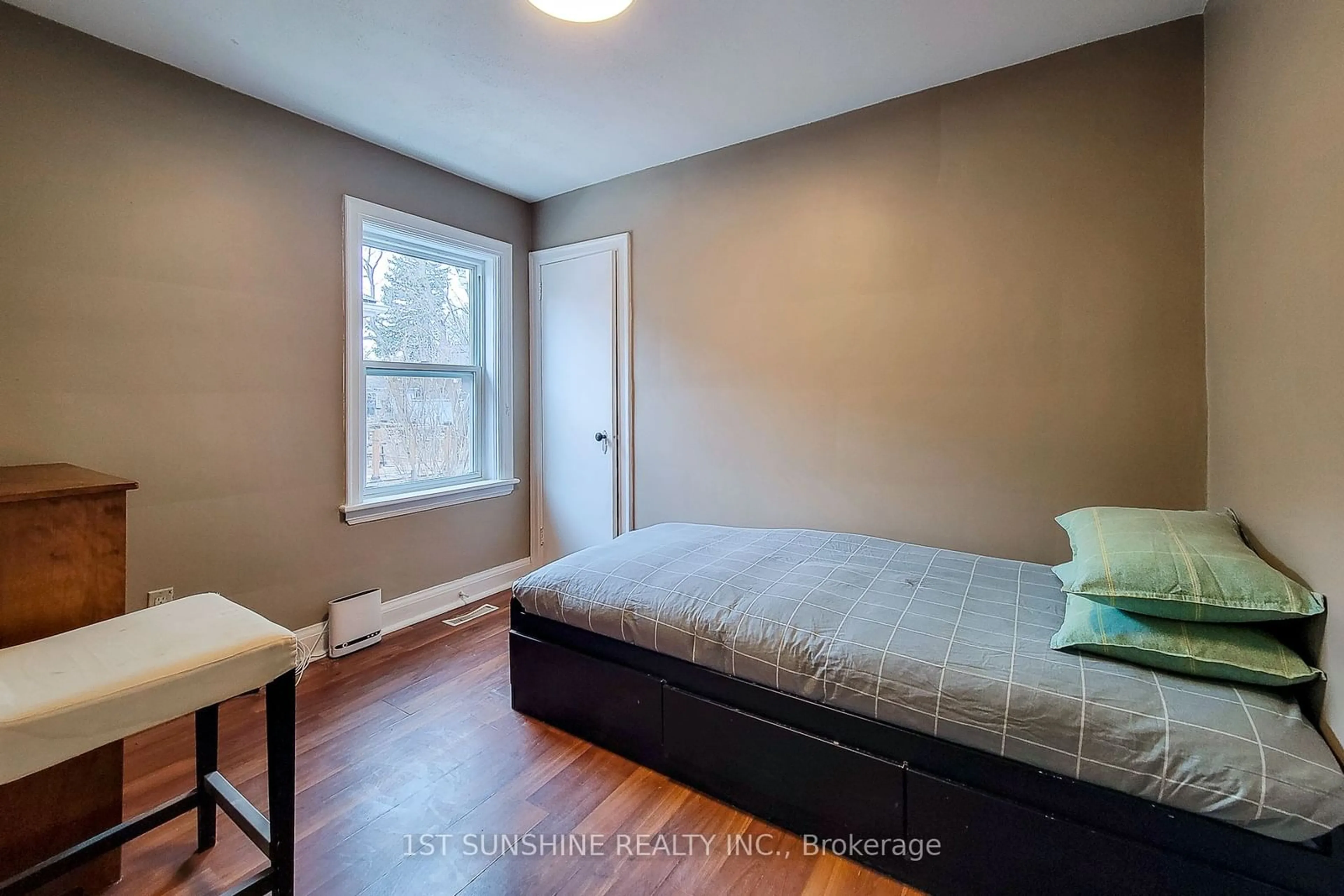 Bedroom with bed, wood/laminate floor for 36 Mapes Ave, Hamilton Ontario L8S 2K4