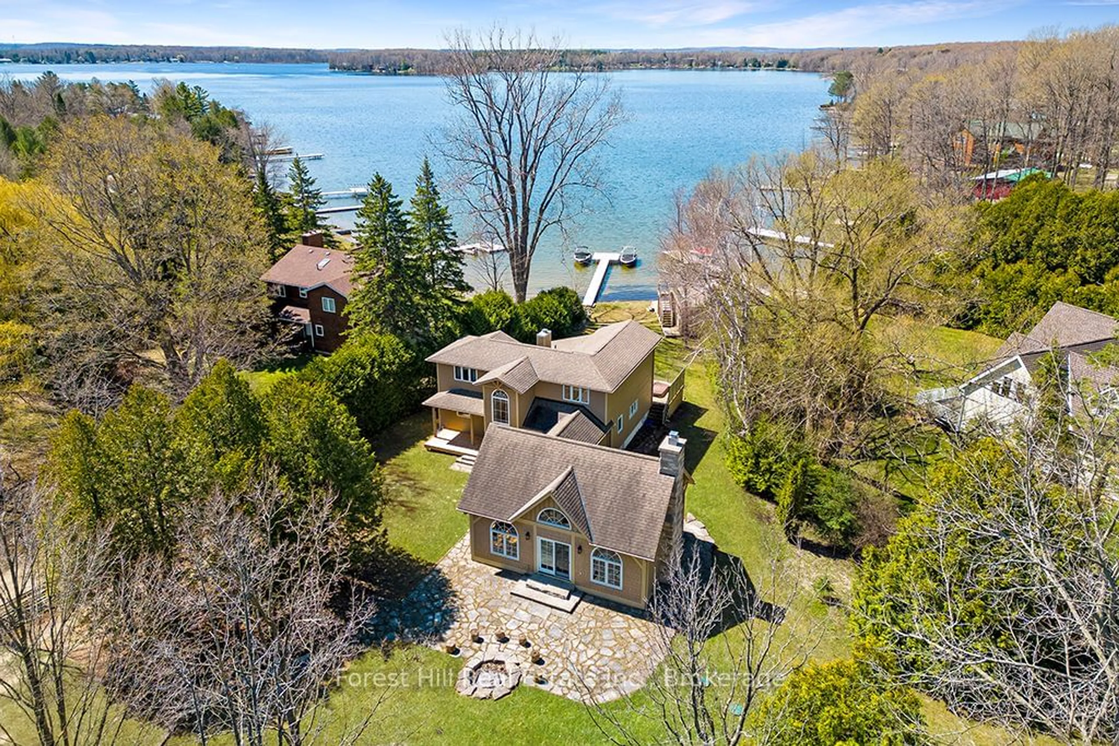 A pic from outside/outdoor area/front of a property/back of a property/a pic from drone, water/lake/river/ocean view for 222 Plantts Point Rd, Grey Highlands Ontario N0C 1E0