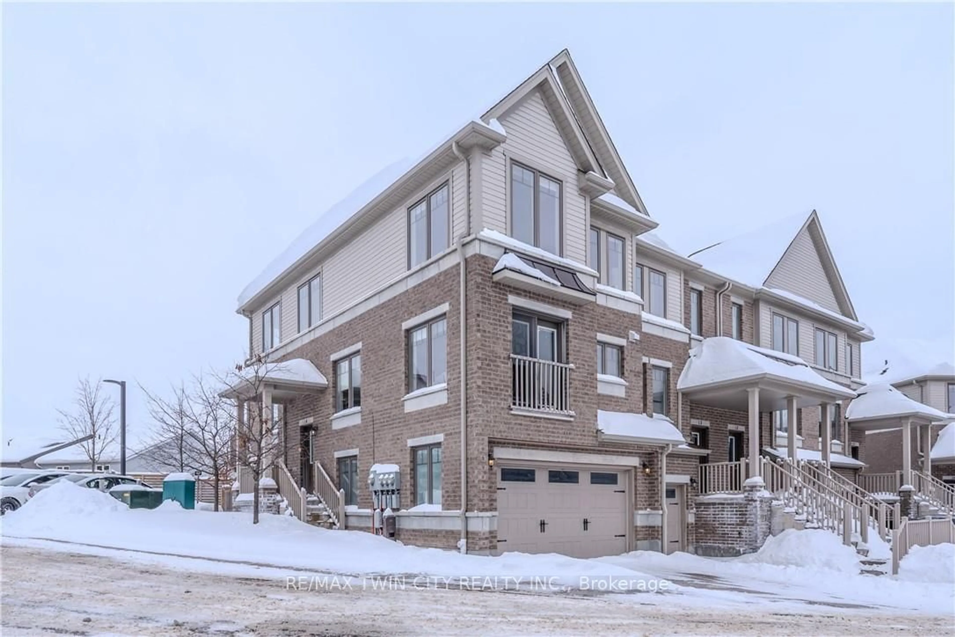 Home with brick exterior material, street for 70 Willowrun Dr #L4, Kitchener Ontario N2A 0J3