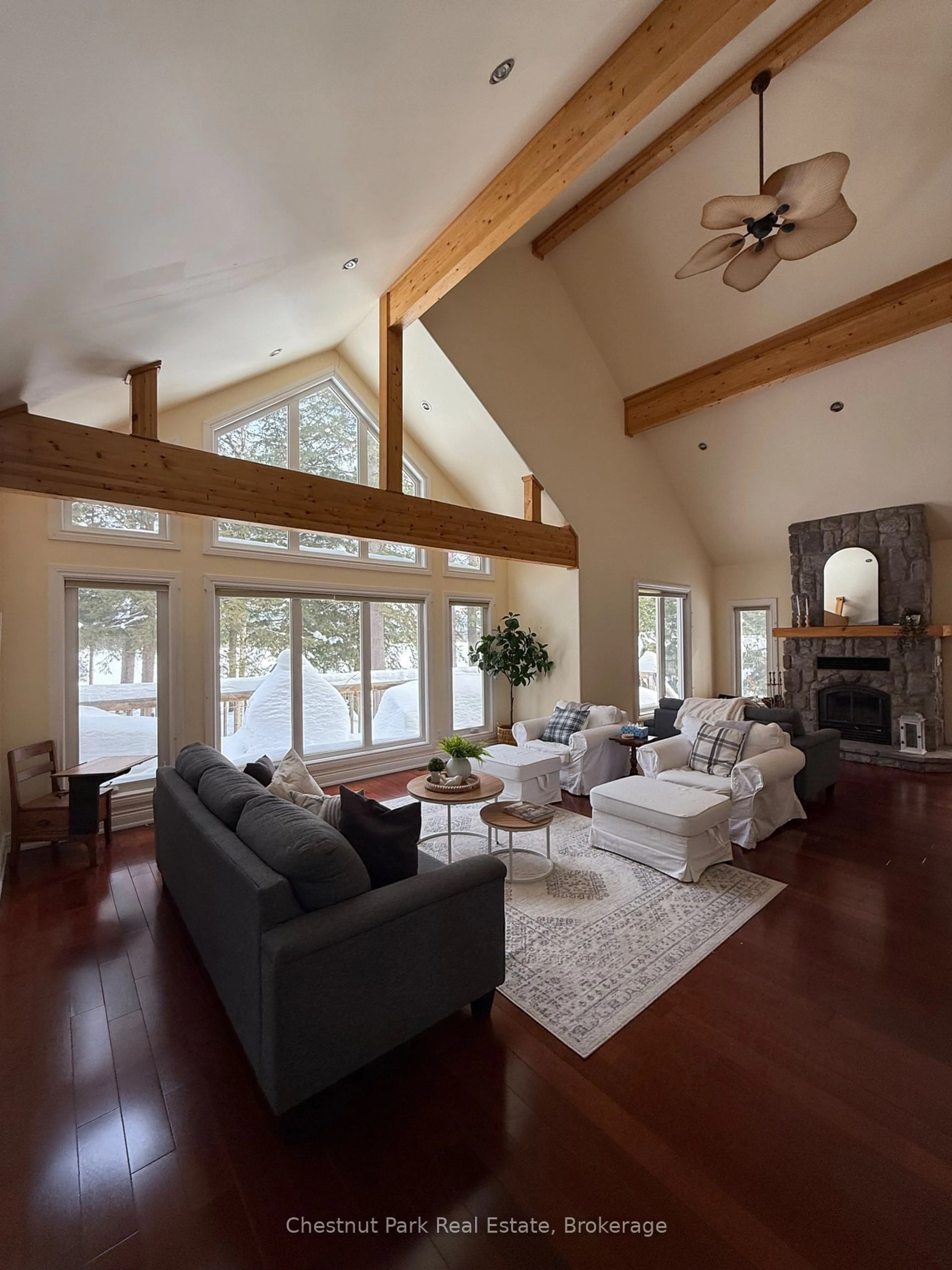 Living room with furniture, wood/laminate floor for 1015 Melody Hill Rd, Muskoka Lakes Ontario P0C 1M0