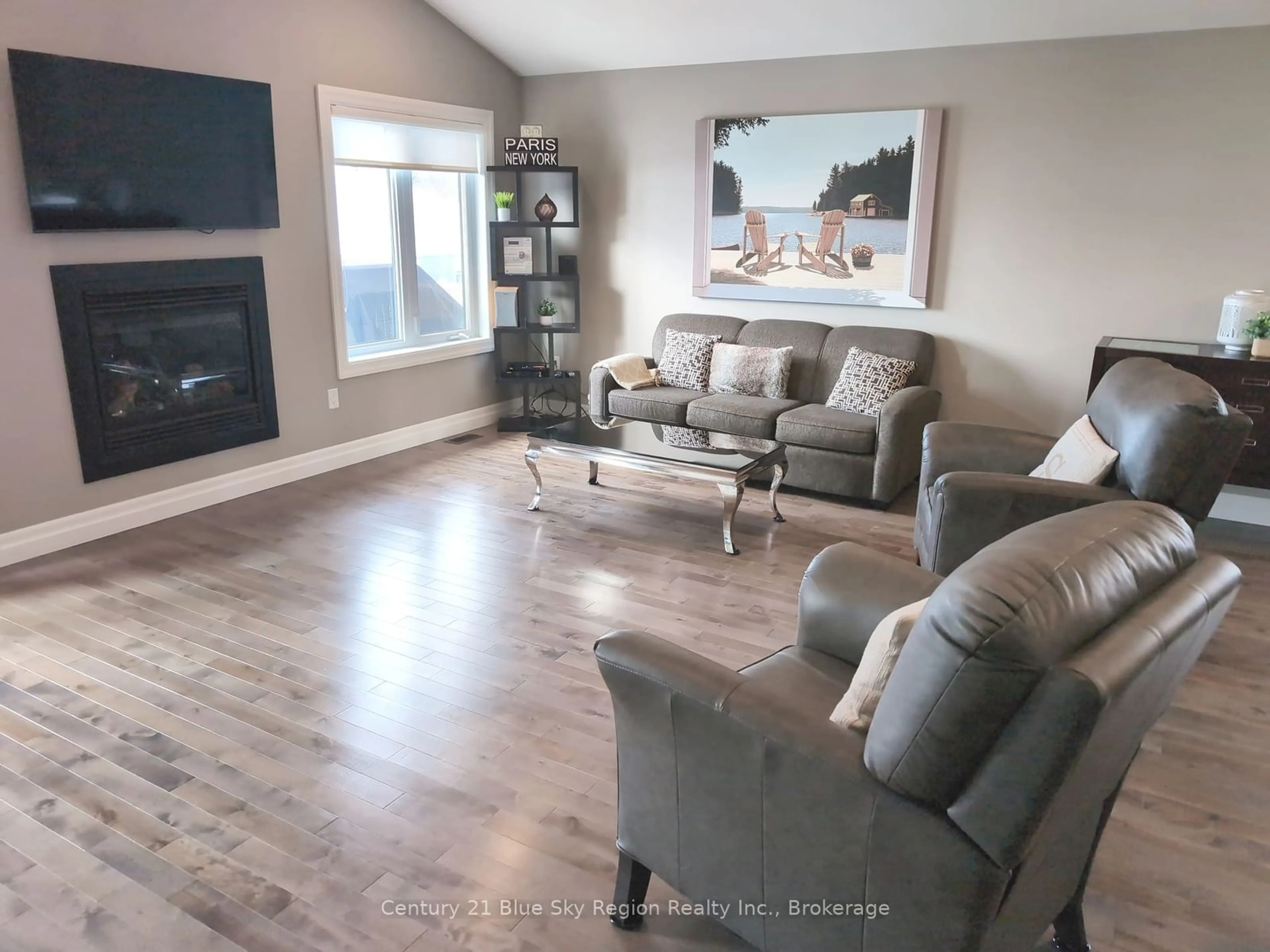 Living room with furniture, wood/laminate floor for 64 Bain Dr, North Bay Ontario P1C 0B6