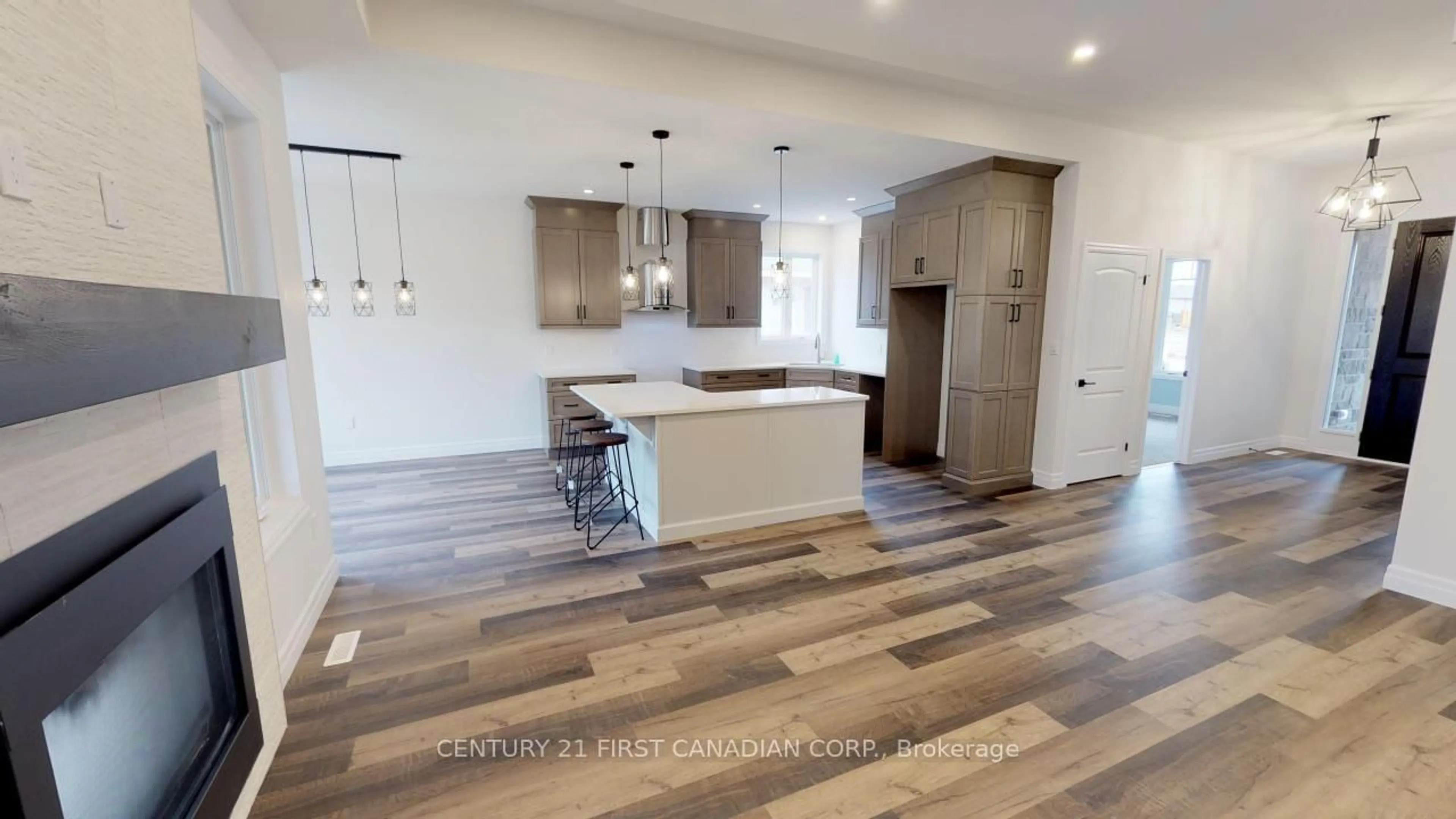 Open concept kitchen, wood/laminate floor for 78 Queen St, North Middlesex Ontario N0M 1A0