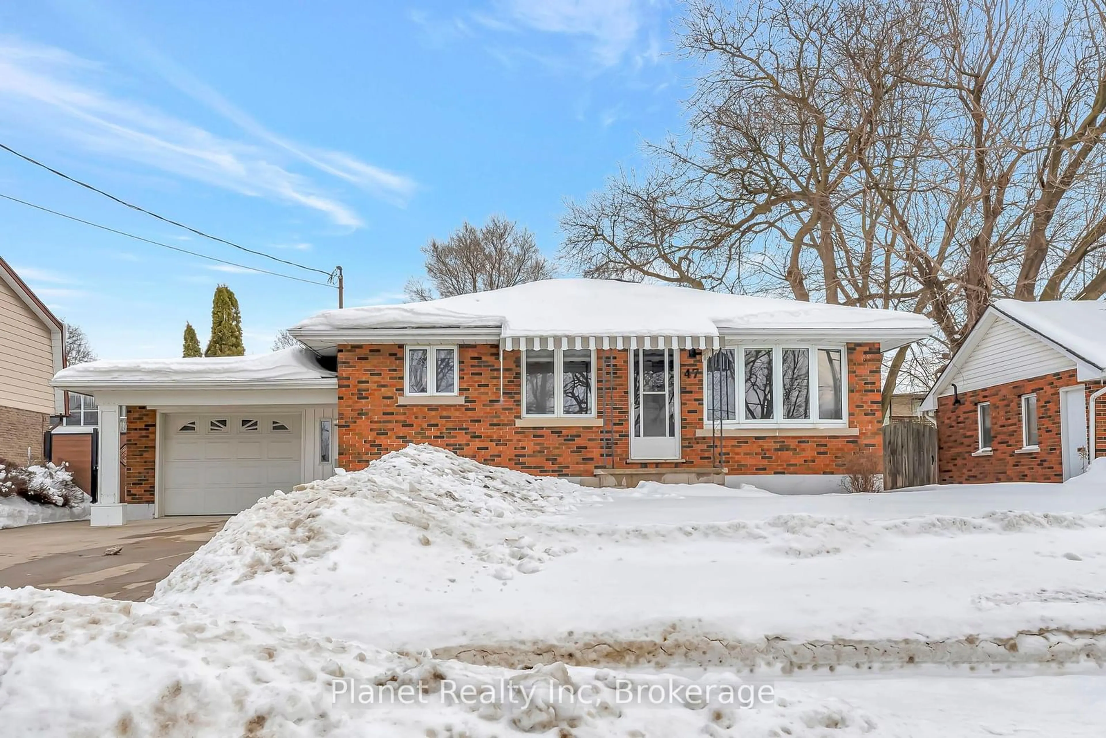 Home with brick exterior material, street for 47 Silvercreek Pkwy, Guelph Ontario N1H 3T1