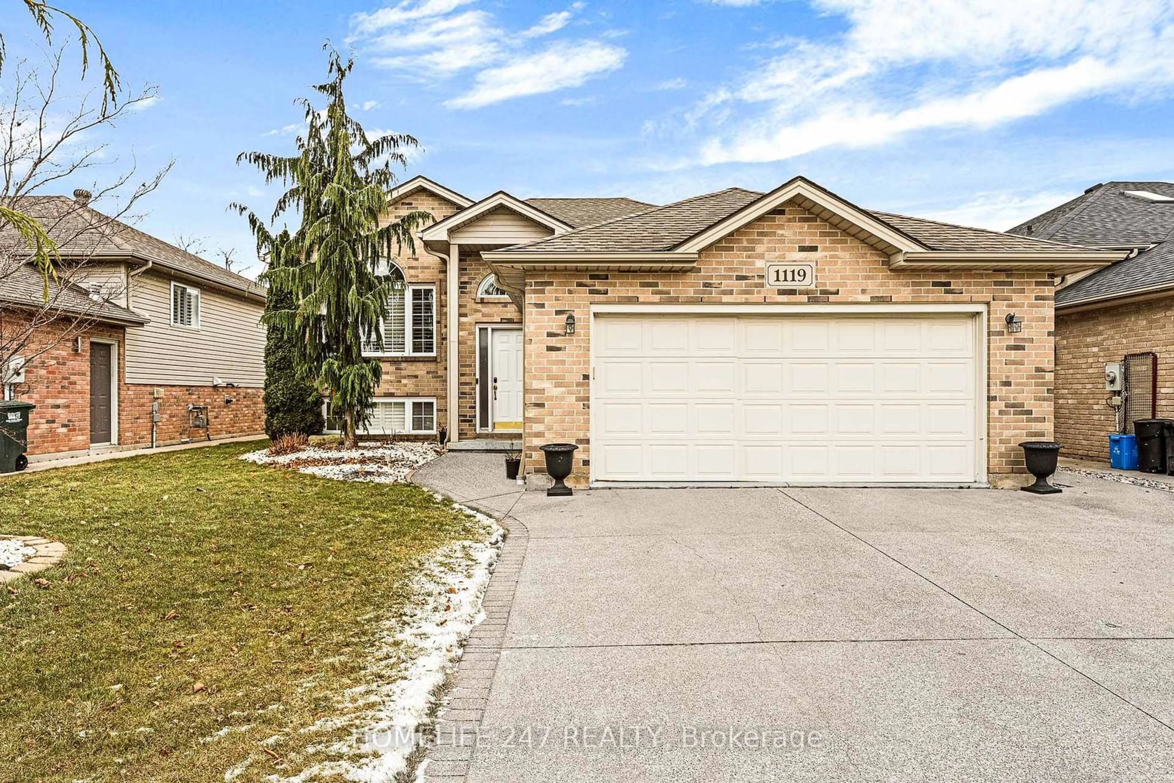 Home with brick exterior material, street for 1119 Monarch Meadows Dr, Lakeshore Ontario N8L 0W5