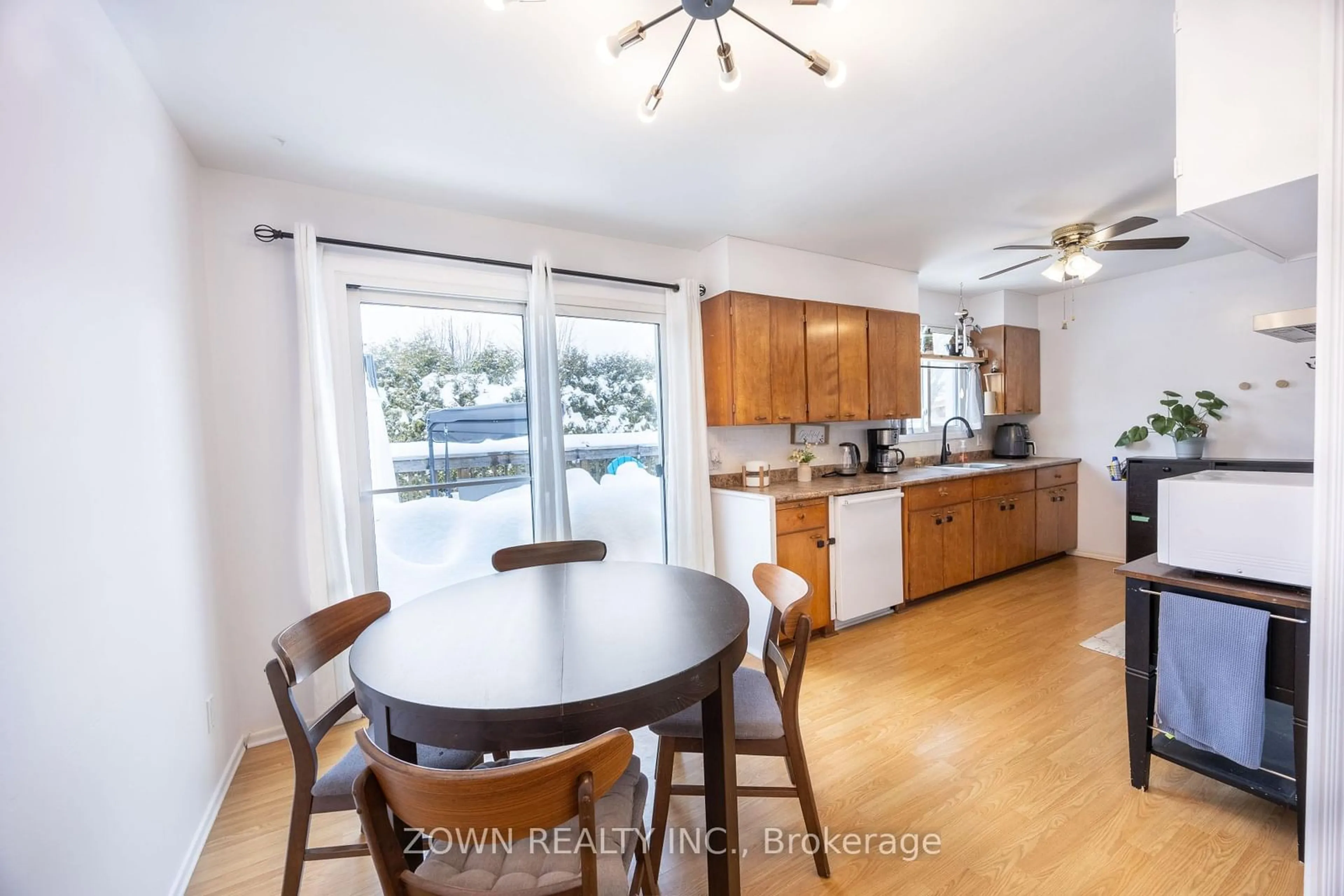 Open concept kitchen, wood/laminate floor for 87 Village Green, Kanata Ontario K2L 1J8