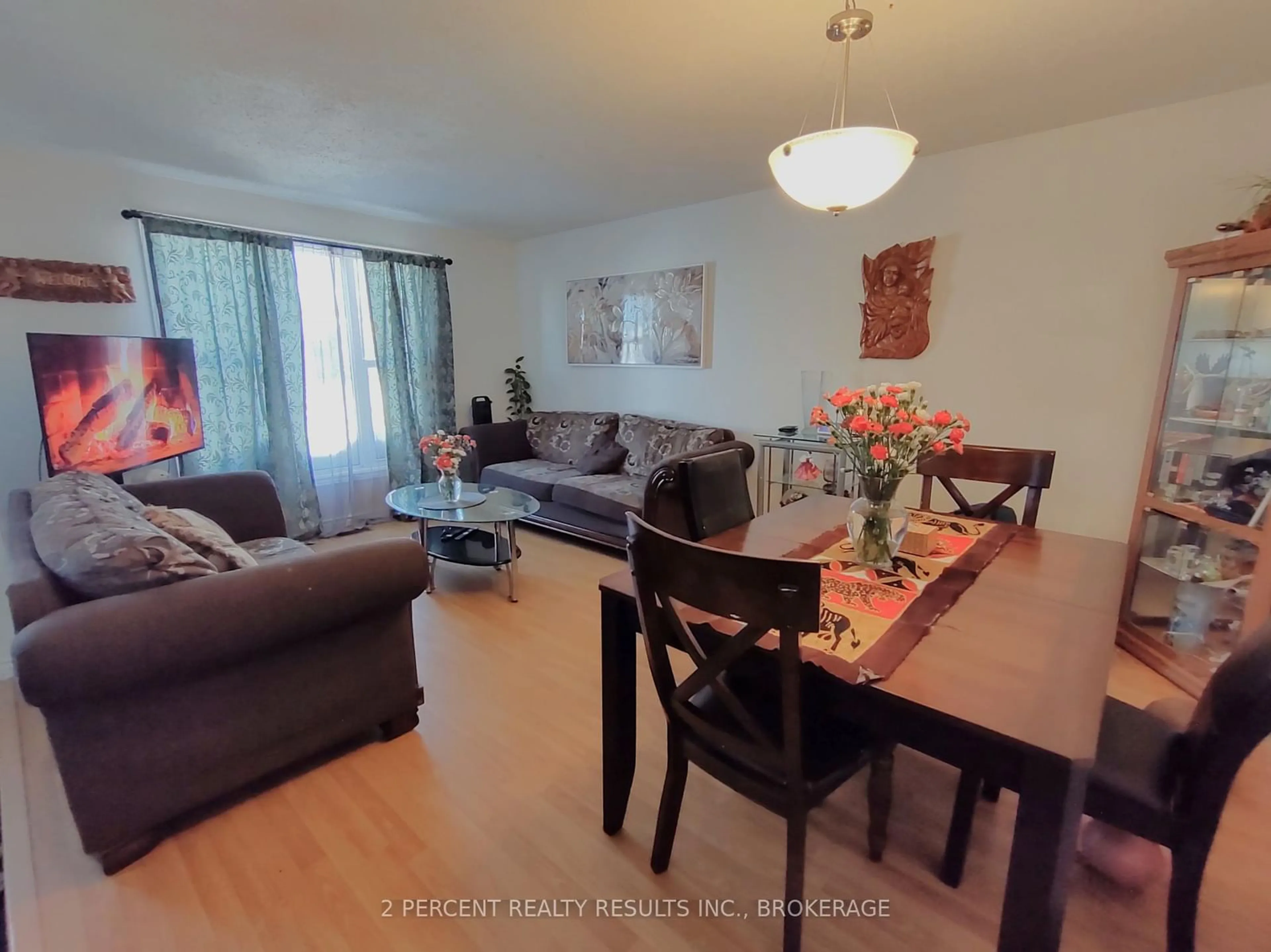 Living room with furniture, wood/laminate floor for 895 Brothlin Cres, Kingston Ontario K7M 7X3