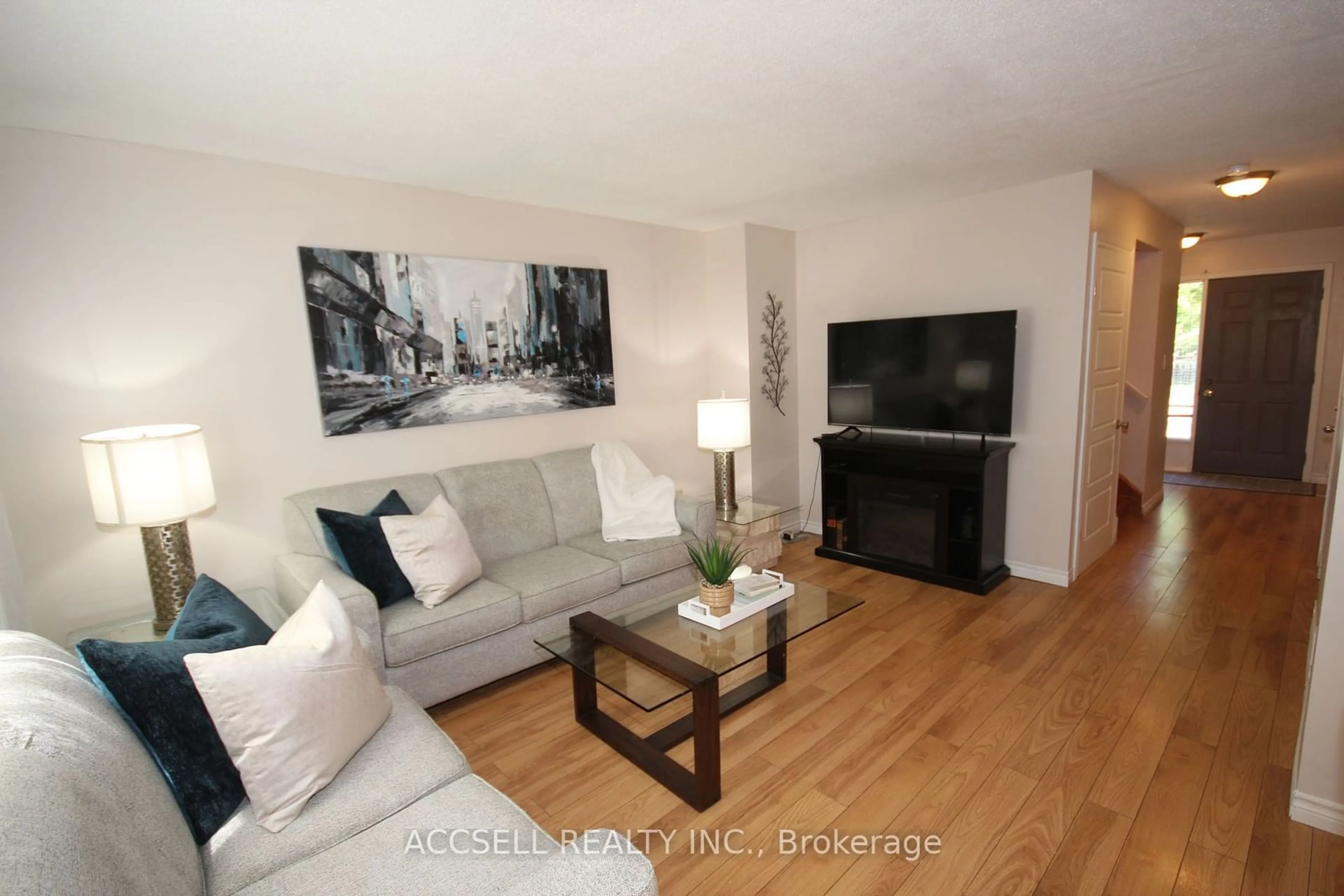 Living room with furniture, wood/laminate floor for 1528 Jalna Blvd, London Ontario N6E 3G1