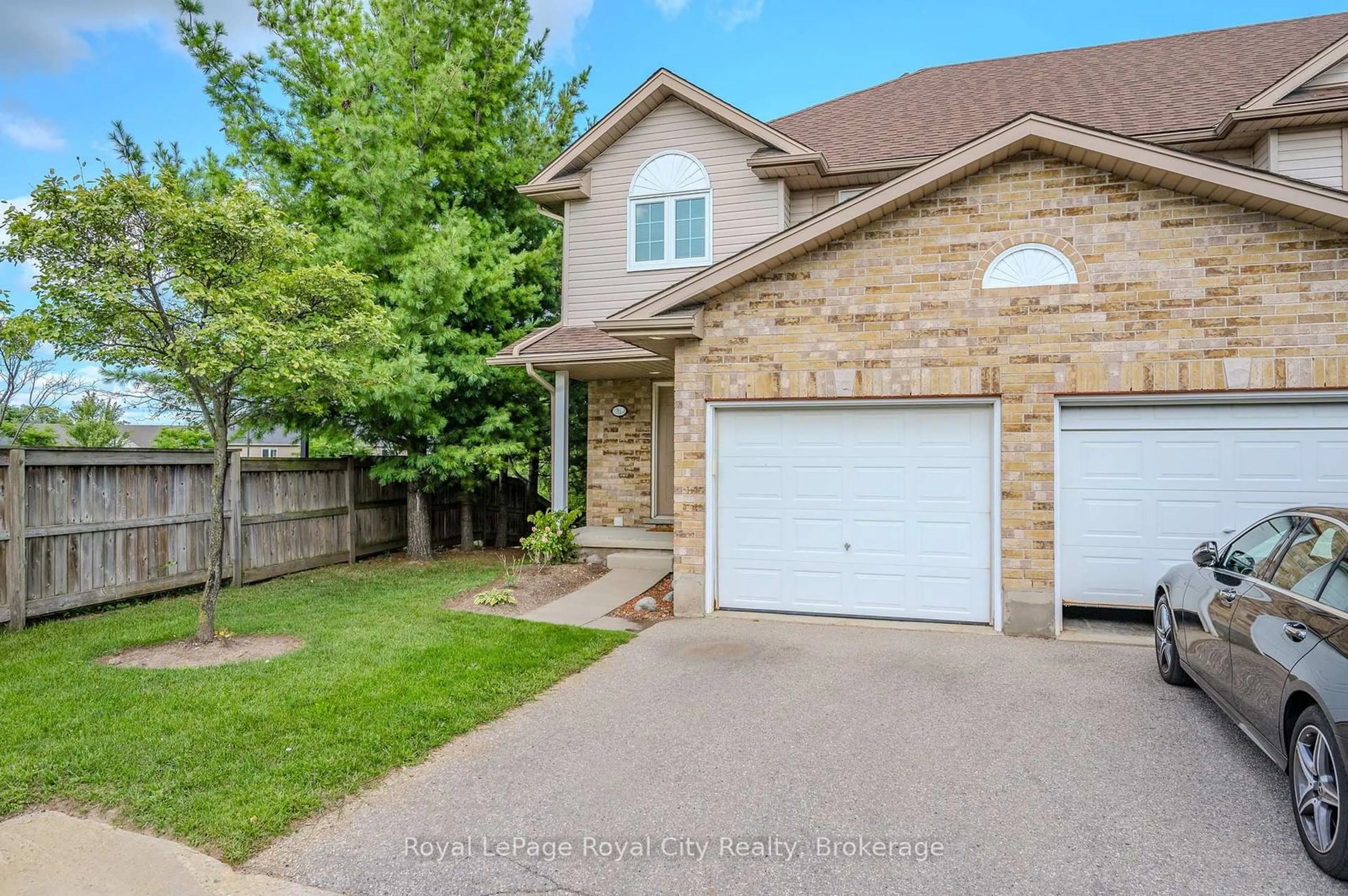 Home with brick exterior material, street for 31 Schroder Cres #31, Guelph Ontario N1E 7M6