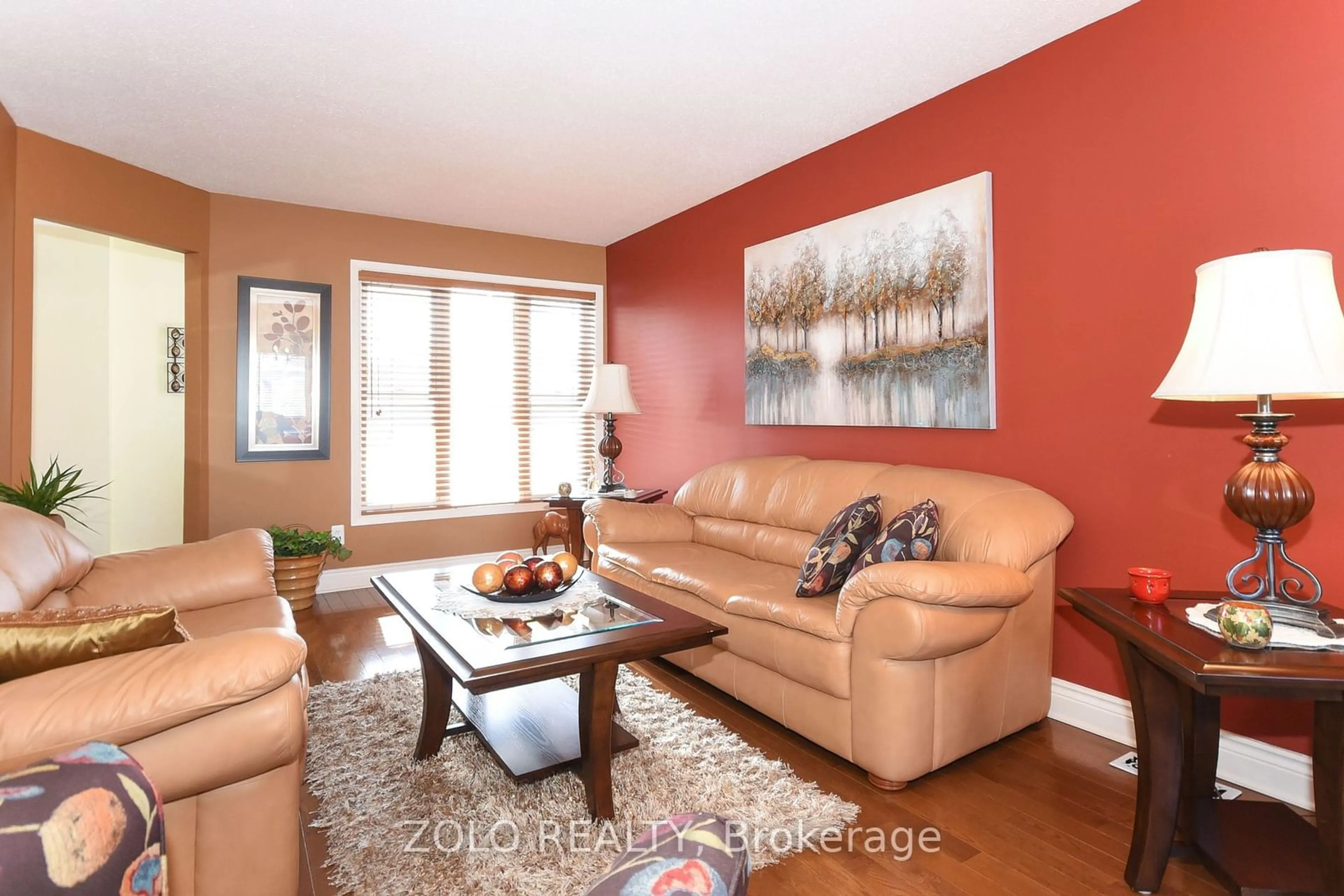 Living room with furniture, wood/laminate floor for 2073 Legrand Cres, Orleans - Cumberland and Area Ontario K1E 3T6