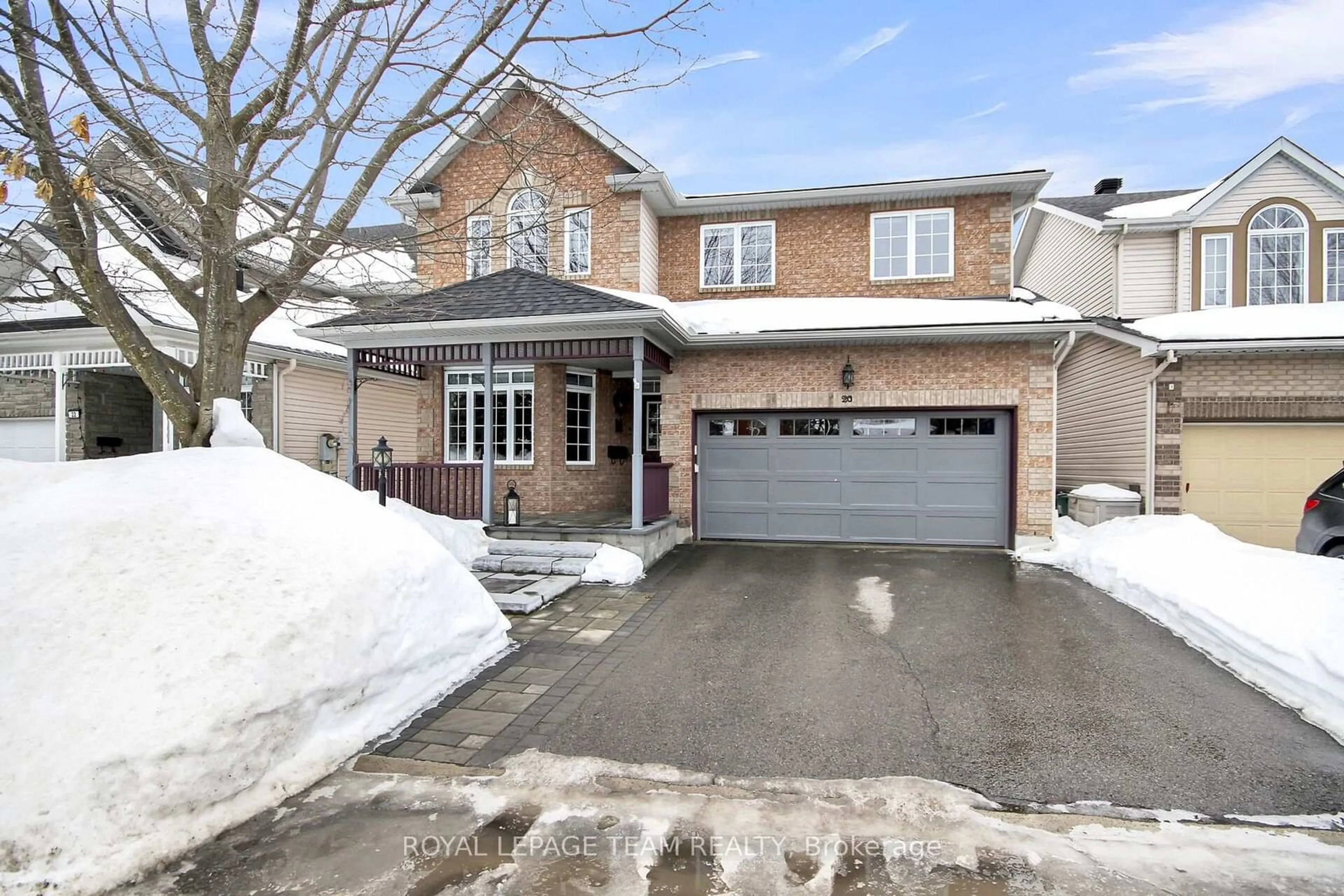 Home with brick exterior material, street for 20 Golder's Green Lane, Barrhaven Ontario K2J 5C1