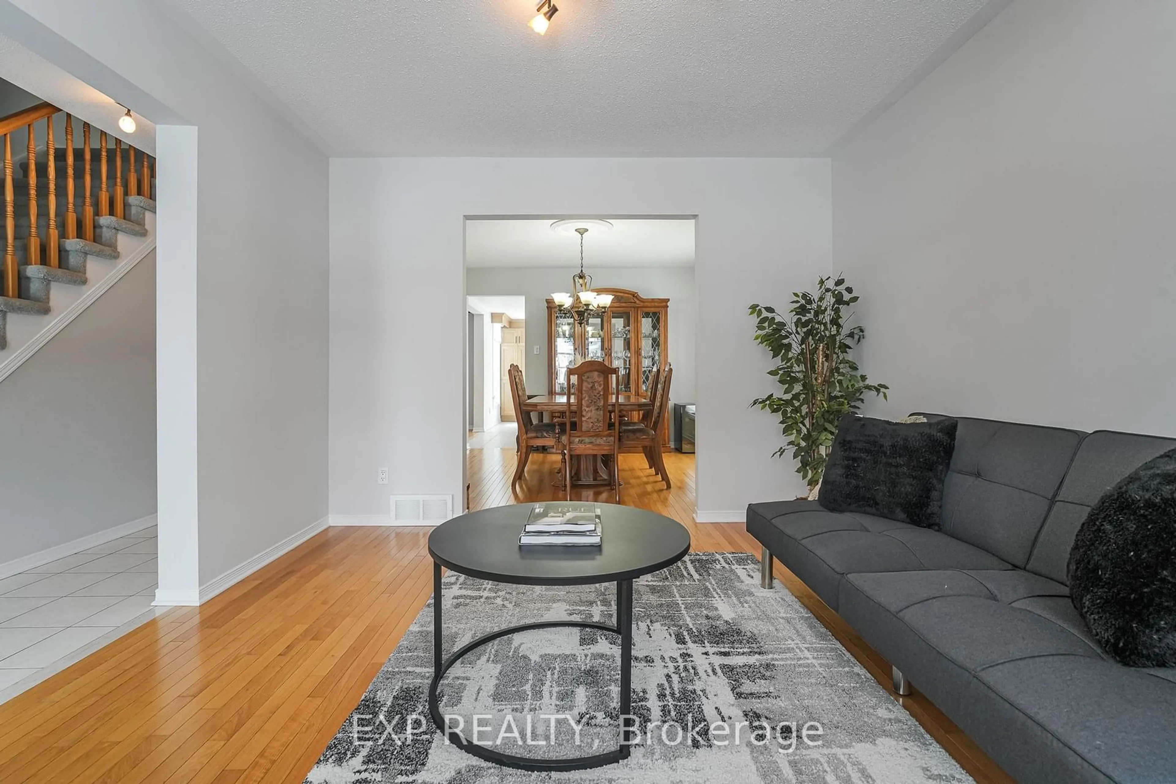 Living room with furniture, wood/laminate floor for 386 Pauline Charron Pl, Vanier and Kingsview Park Ontario K1L 8L3