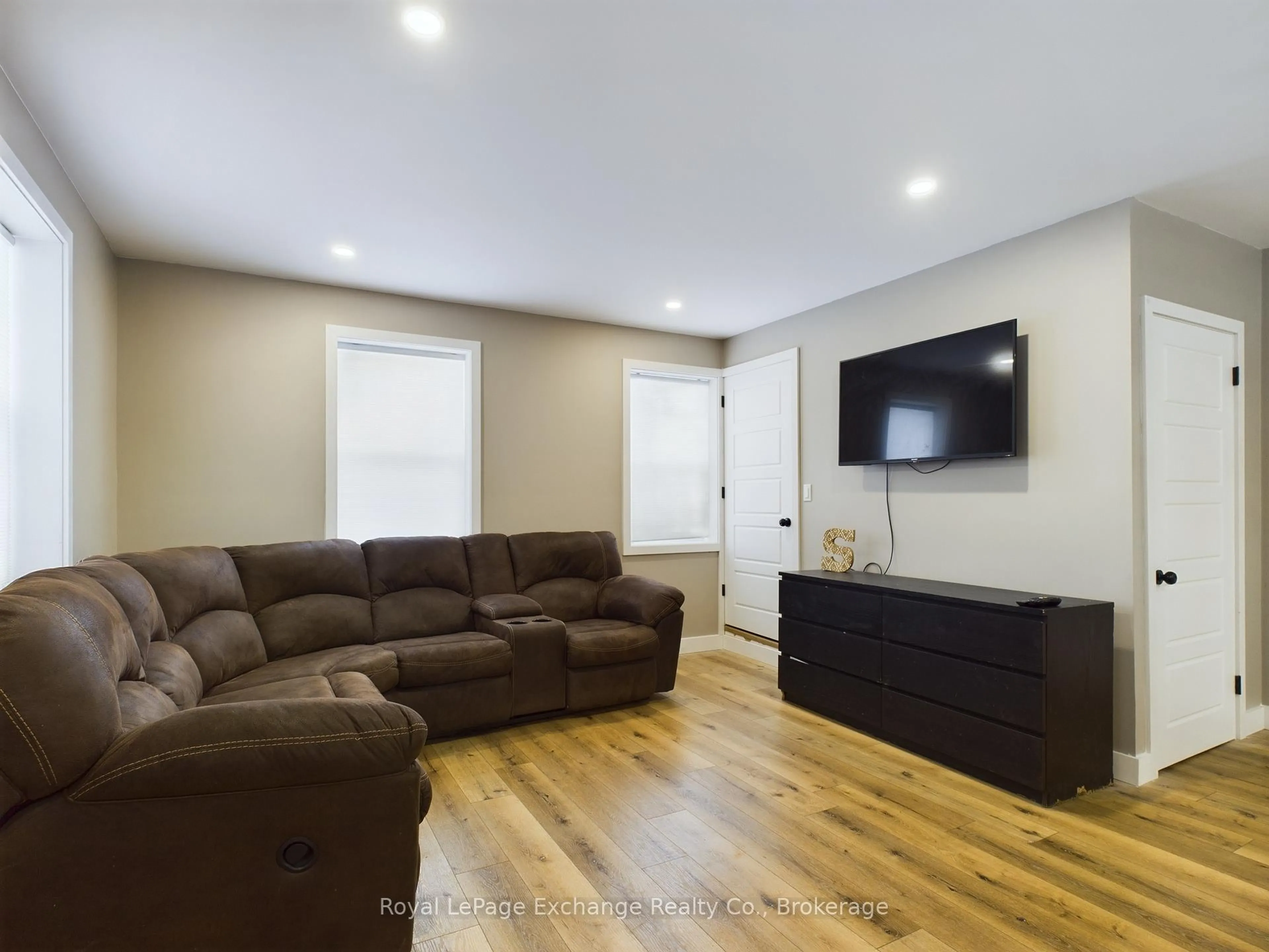 Living room with furniture, wood/laminate floor for 58 Absalom St, South Bruce Ontario N0G 2J0