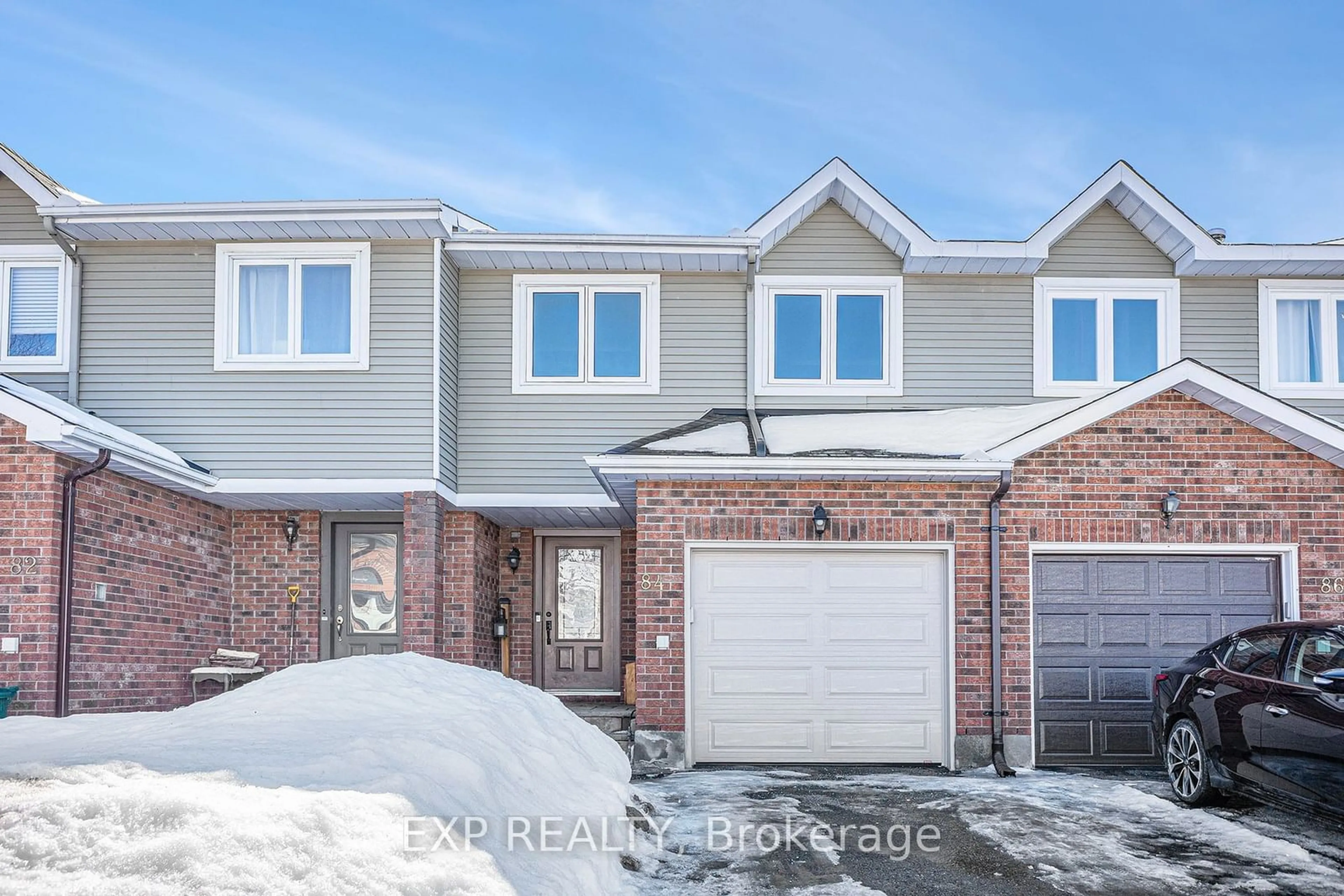 Home with brick exterior material, street for 84 Woodford Way, Barrhaven Ontario K2J 4B5