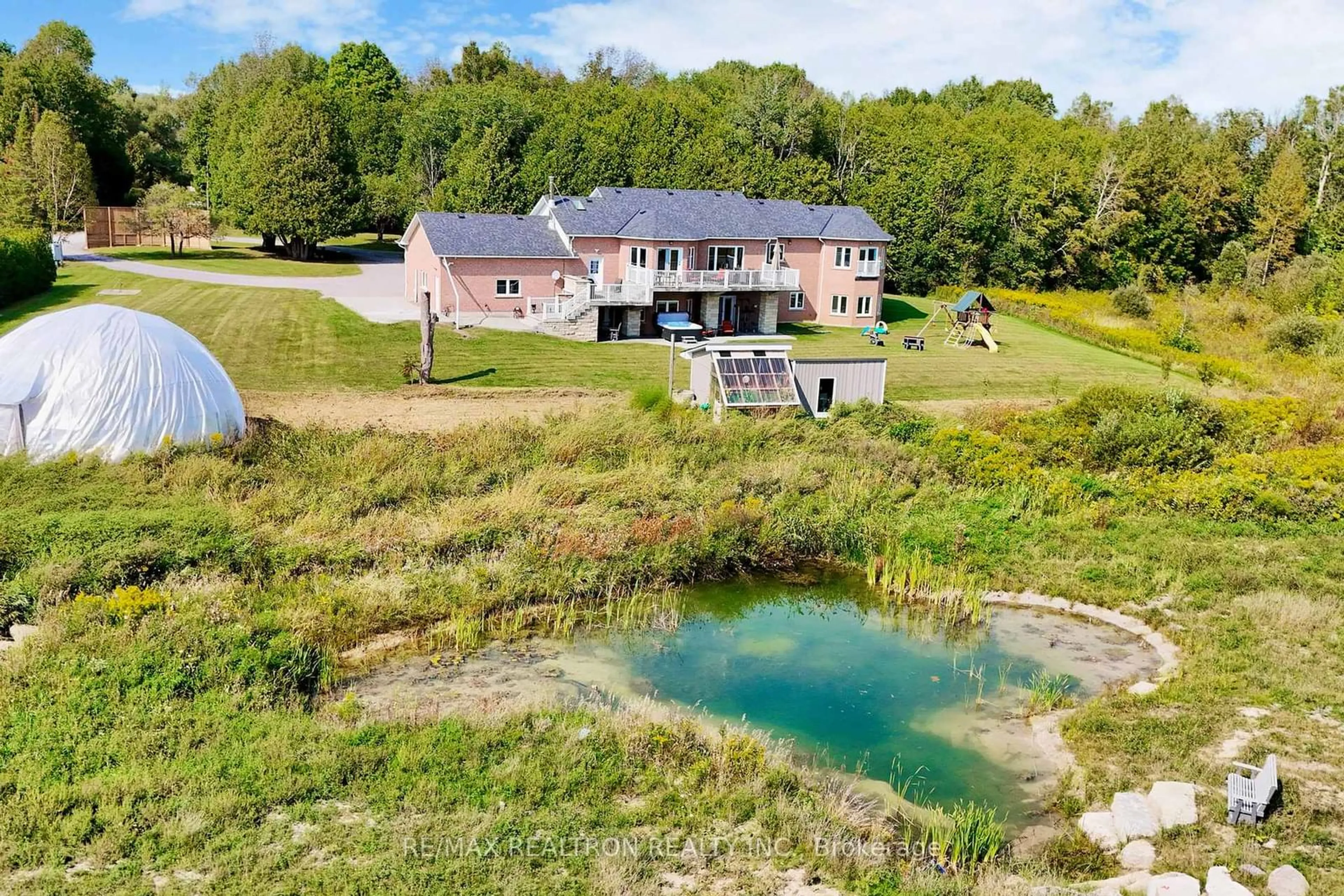 A pic from outside/outdoor area/front of a property/back of a property/a pic from drone, water/lake/river/ocean view for 1599 Moore Dr, Cavan Monaghan Ontario L0A 1C0