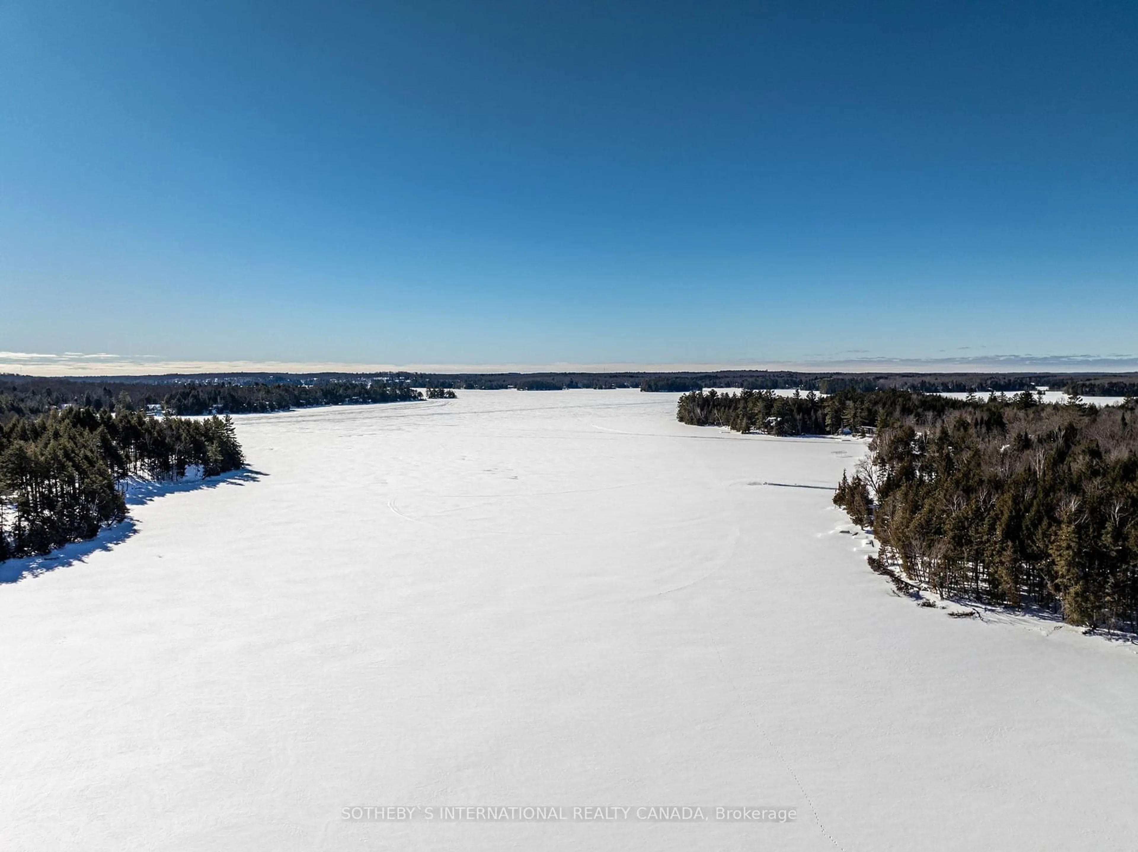 A pic from outside/outdoor area/front of a property/back of a property/a pic from drone, water/lake/river/ocean view for 21 Luke Lane, North Kawartha Ontario K0L 1A0