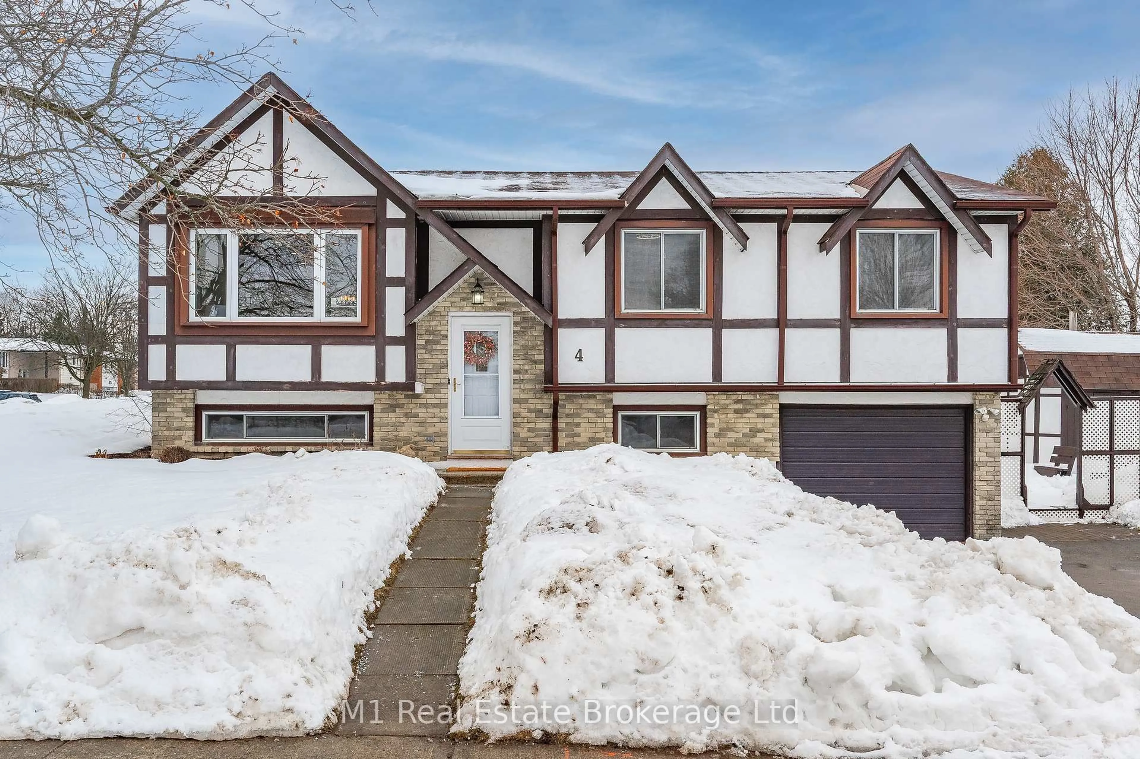 Home with vinyl exterior material, street for 4 Longfellow Ave, Guelph Ontario N1E 6G3