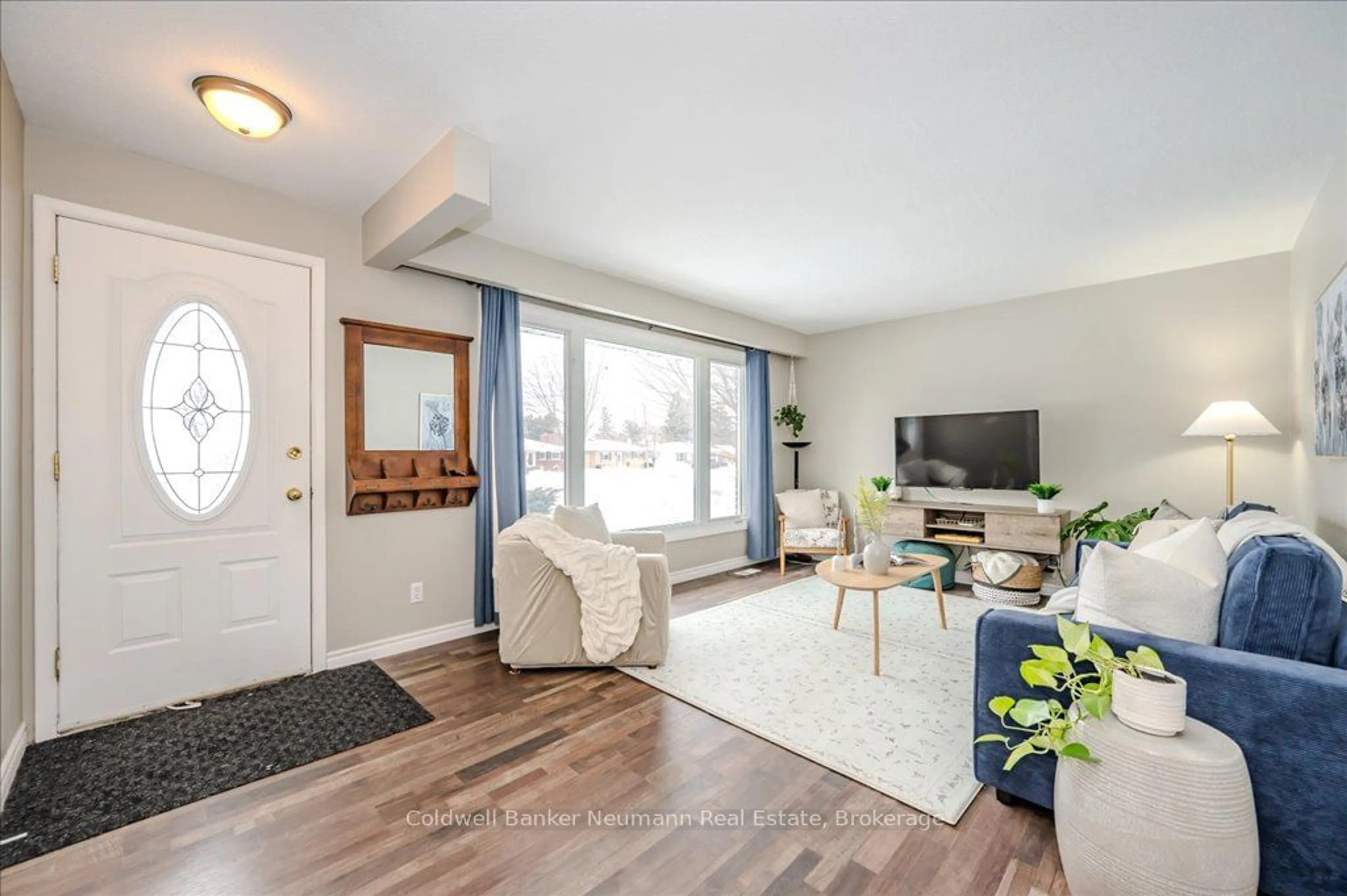 Living room with furniture, wood/laminate floor for 27 Sleeman Ave, Guelph Ontario N1H 6G2