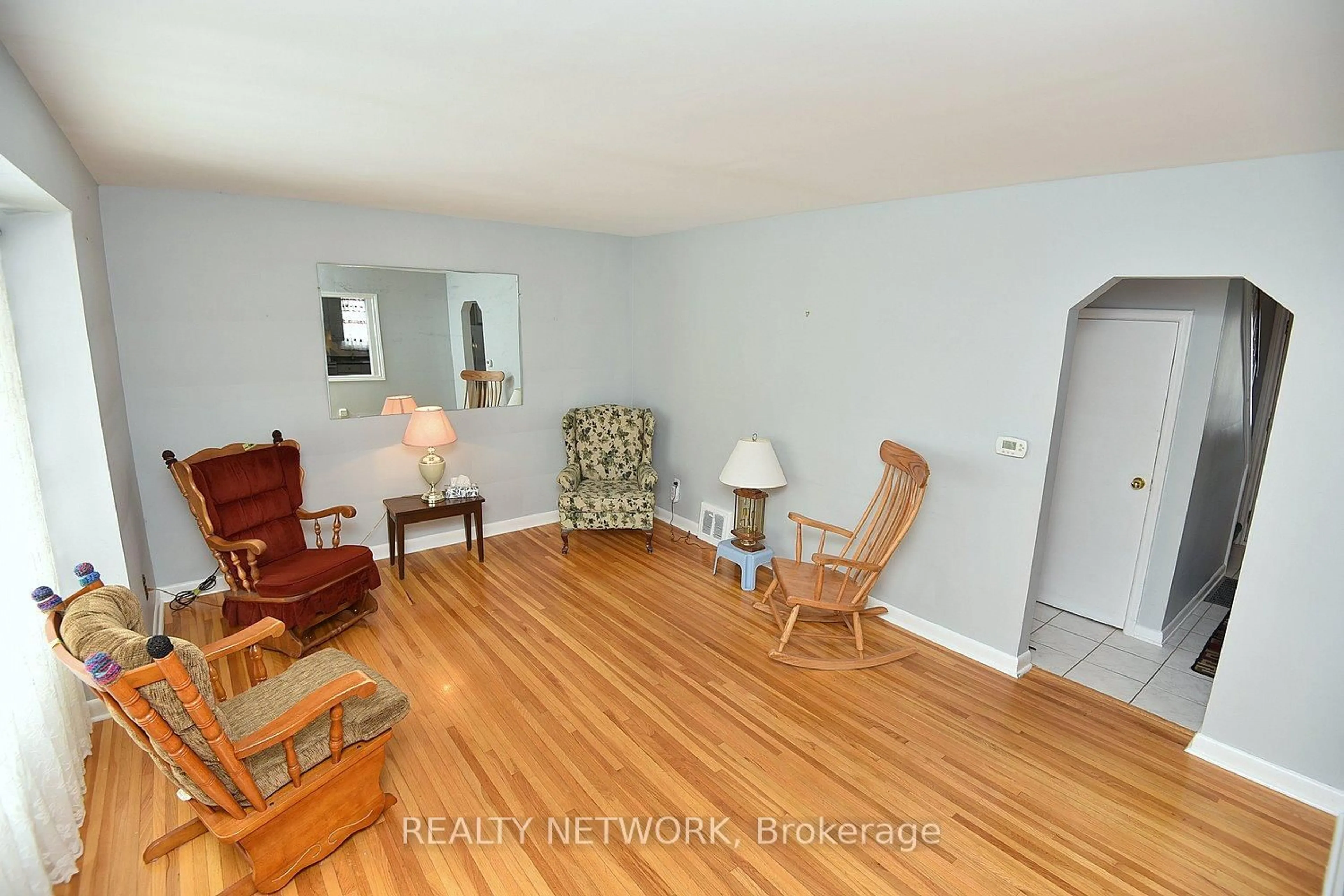 Living room with furniture, wood/laminate floor for 21 Eastvale Pl, Hamilton Ontario L8H 1N9