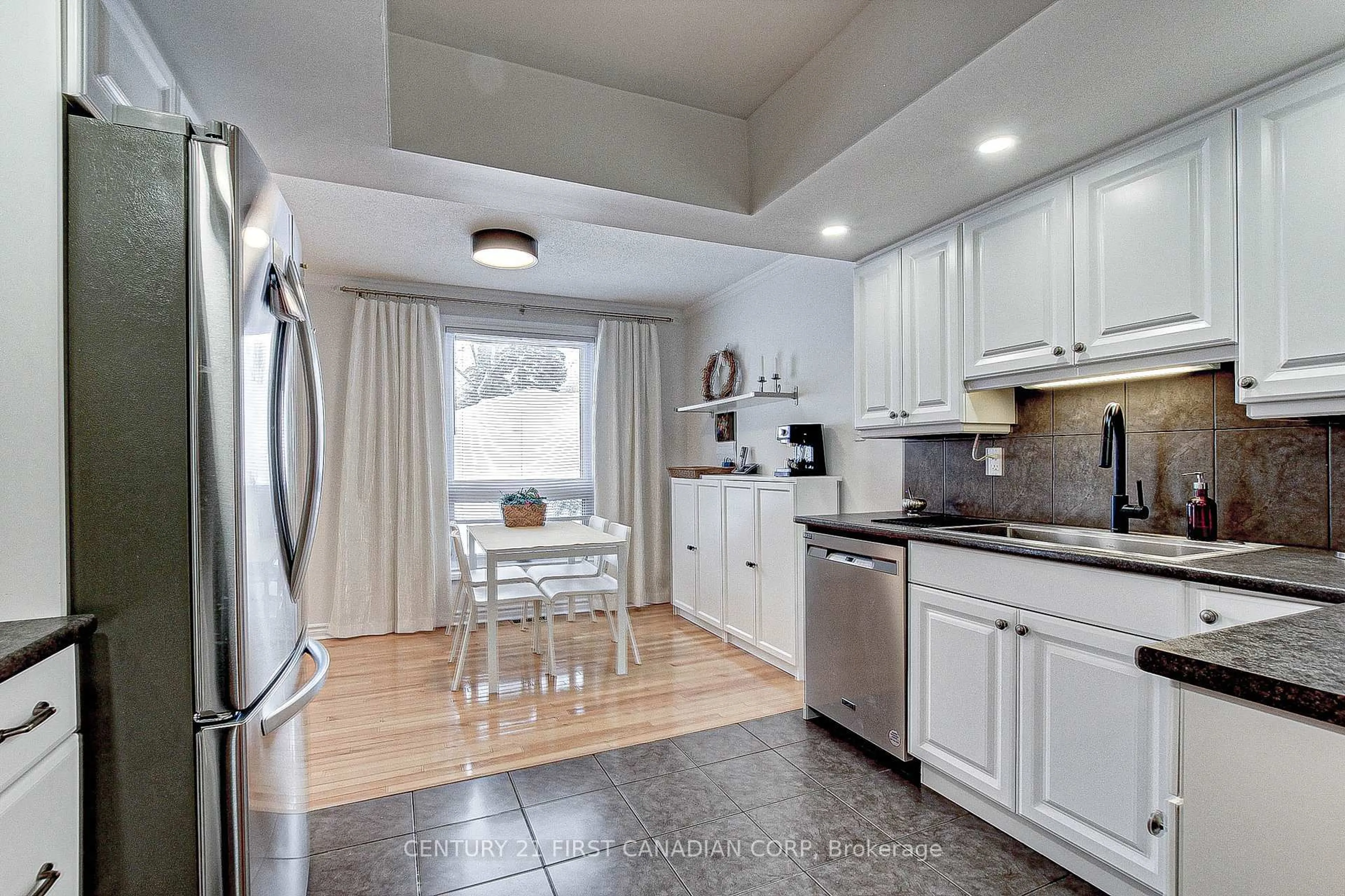 Open concept kitchen, ceramic/tile floor for 417 Everglade Cres, London Ontario N6H 4M8