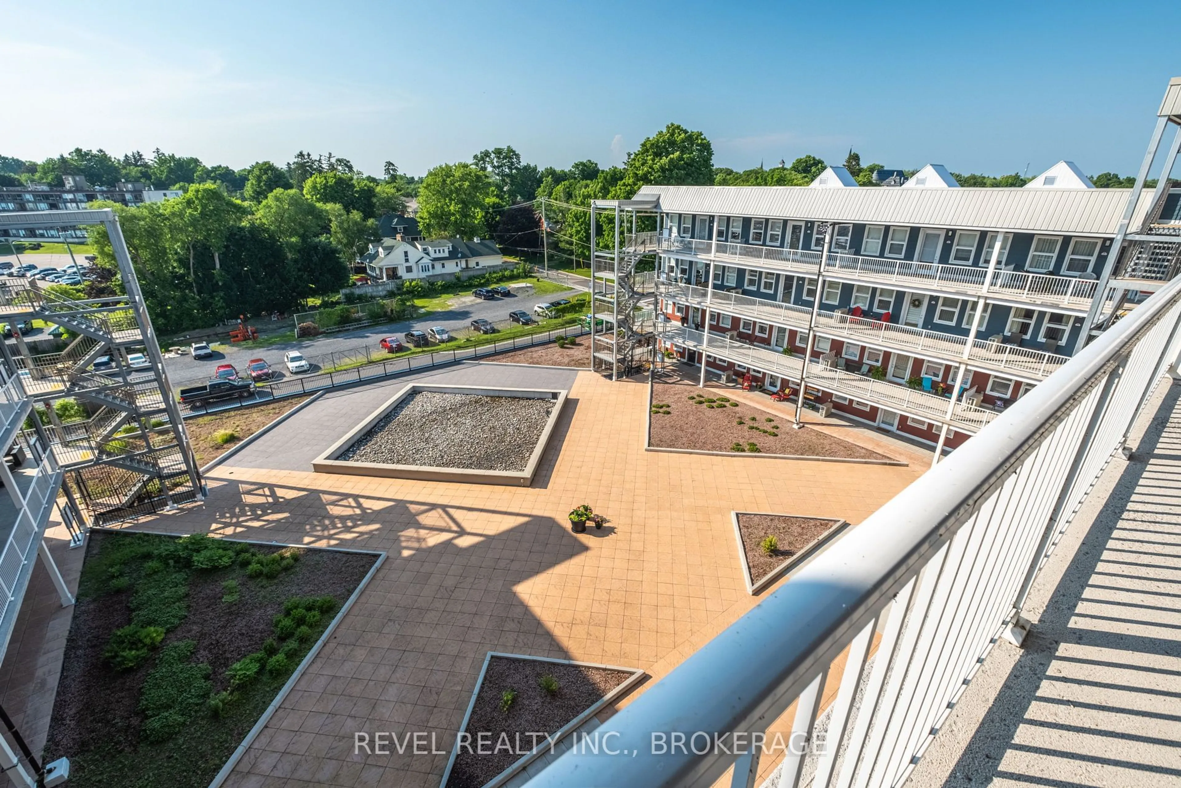 A pic from outside/outdoor area/front of a property/back of a property/a pic from drone, city buildings view from balcony for 130 WATER St #501, Gananoque Ontario K7G 0A8