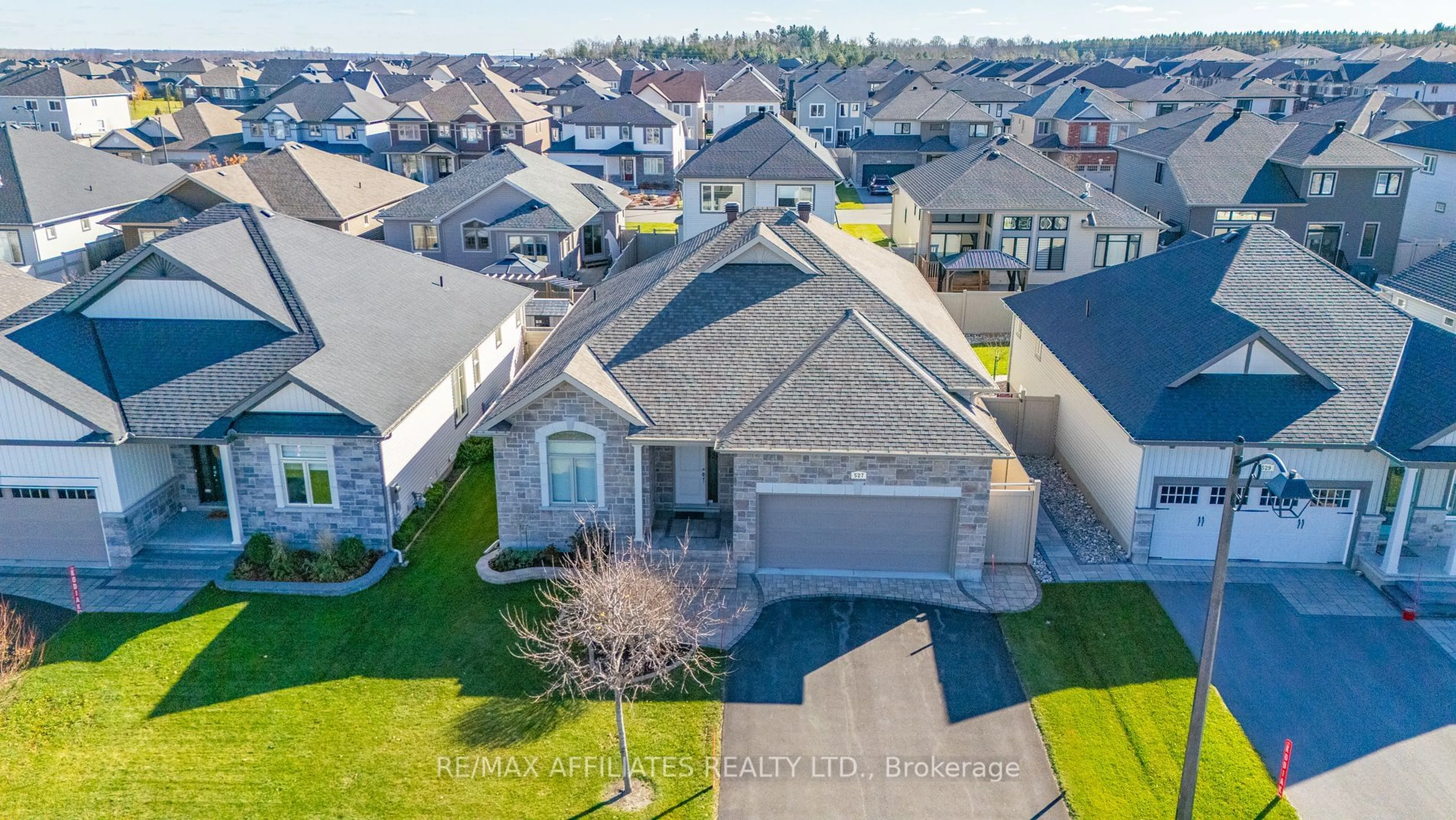 A pic from outside/outdoor area/front of a property/back of a property/a pic from drone, street for 527 Ace St, Kanata Ontario K2V 0E9