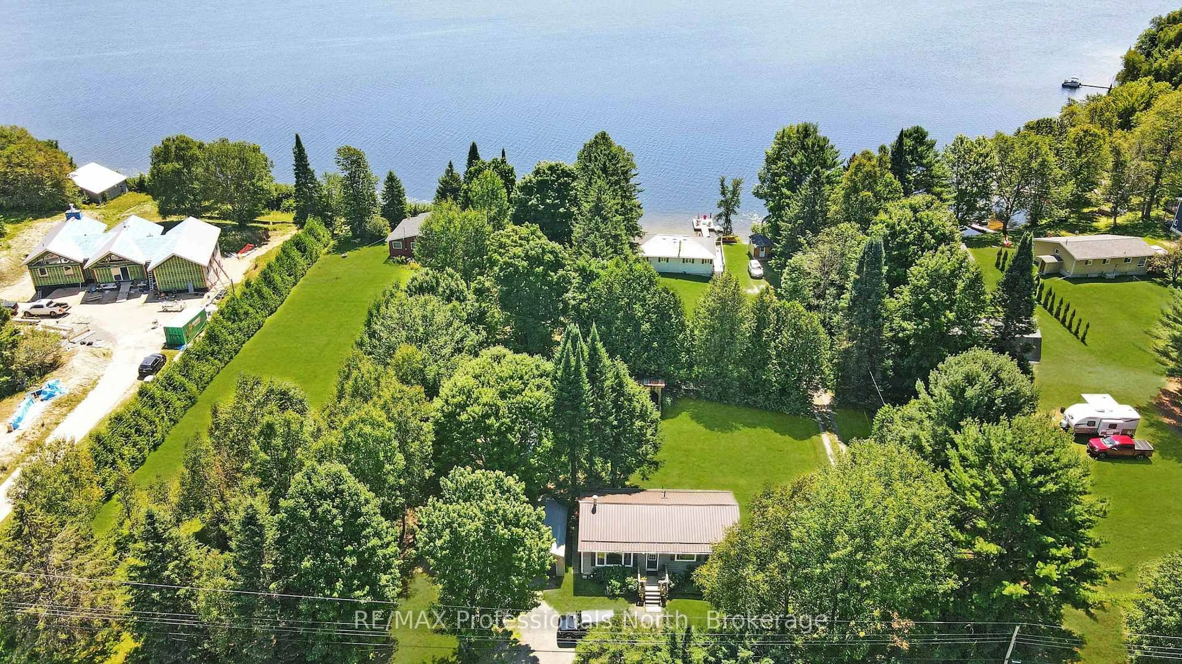 A pic from outside/outdoor area/front of a property/back of a property/a pic from drone, water/lake/river/ocean view for 1358 North Shore Rd, Algonquin Highlands Ontario K0M 1S0