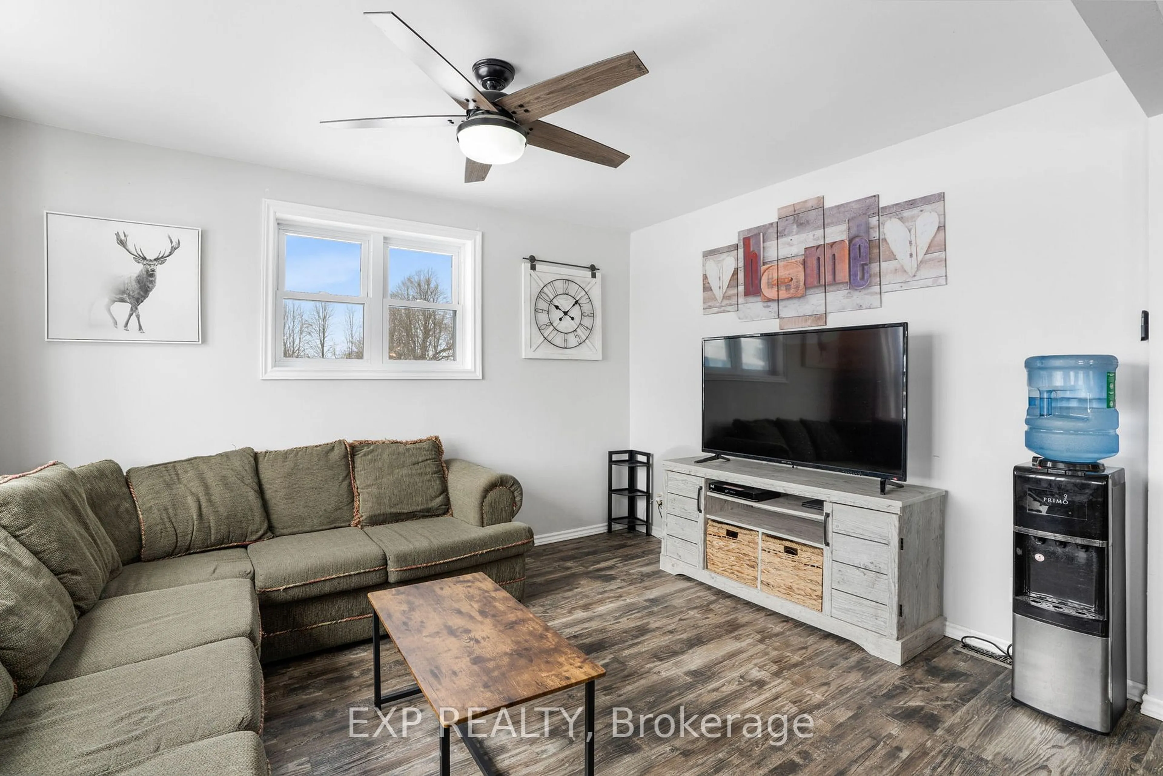 Living room with furniture, wood/laminate floor for 21023 County 10 Rd, North Glengarry Ontario K0C 1A0