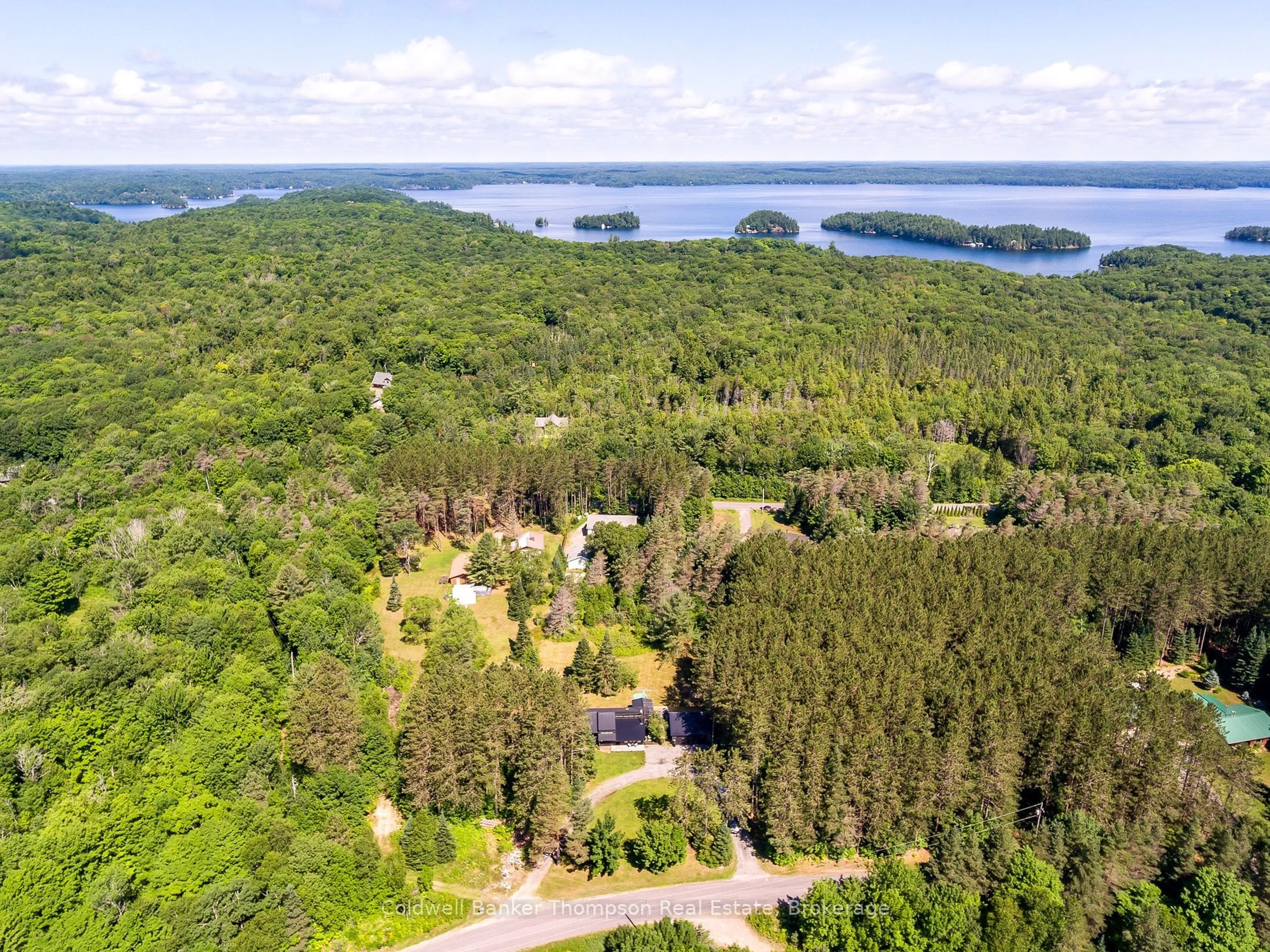 A pic from outside/outdoor area/front of a property/back of a property/a pic from drone, water/lake/river/ocean view for 1049 Lawrence Pit Rd, Muskoka Lakes Ontario P0B 1M0