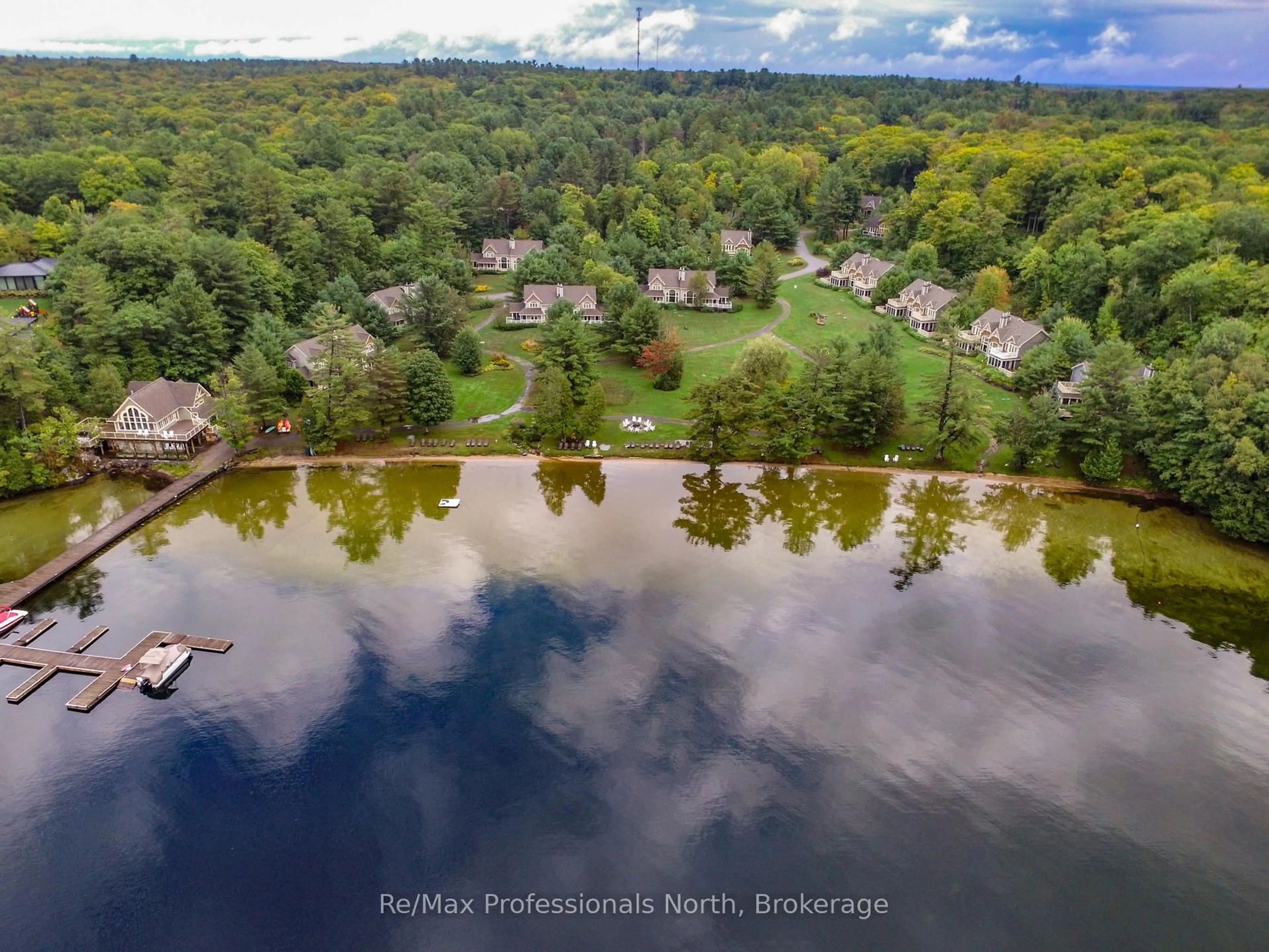 A pic from outside/outdoor area/front of a property/back of a property/a pic from drone, water/lake/river/ocean view for 3876 MUSKOKA ROAD 118 #Sandfield 2, Week 10, Muskoka Lakes Ontario P0B 1J0