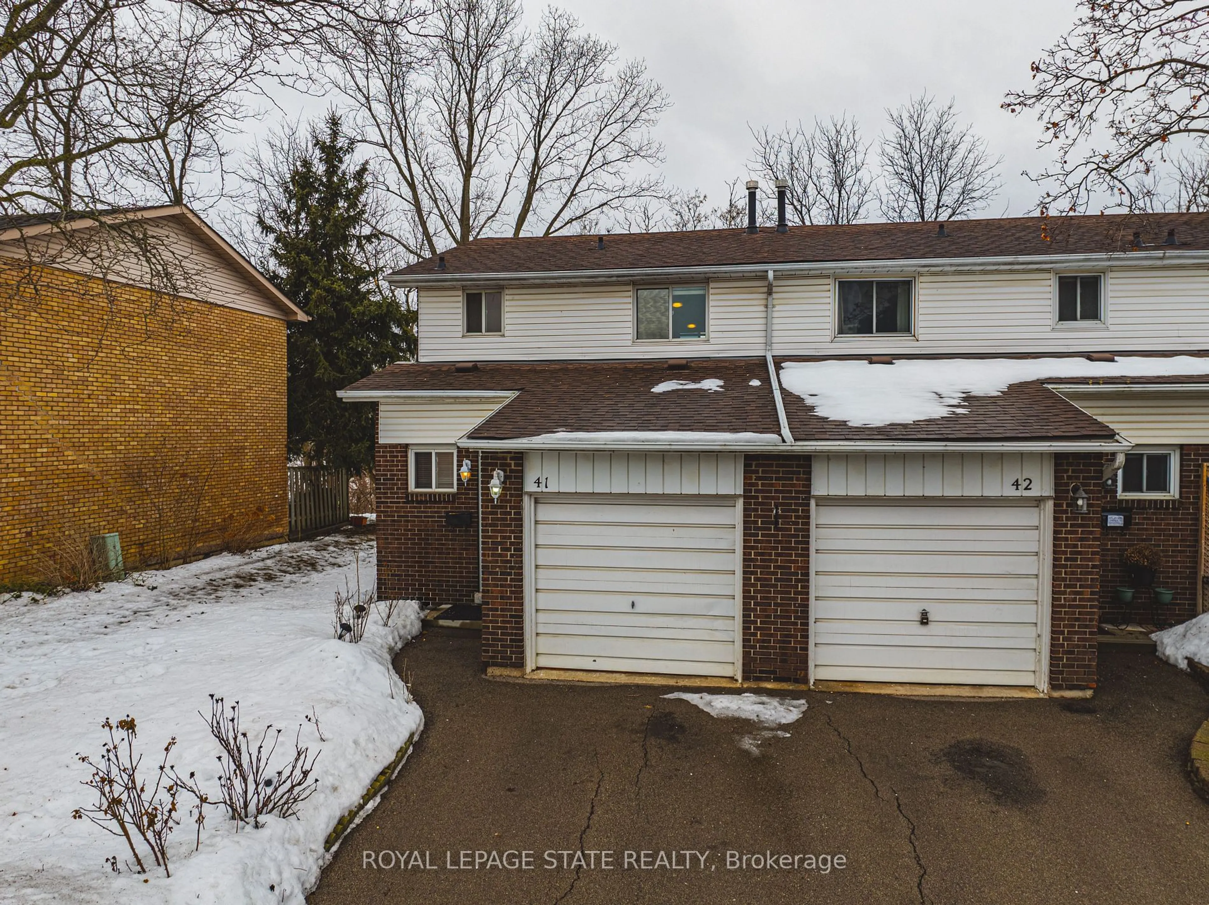 A pic from outside/outdoor area/front of a property/back of a property/a pic from drone, street for 100 Quigley Rd #41, Hamilton Ontario L8K 6J1