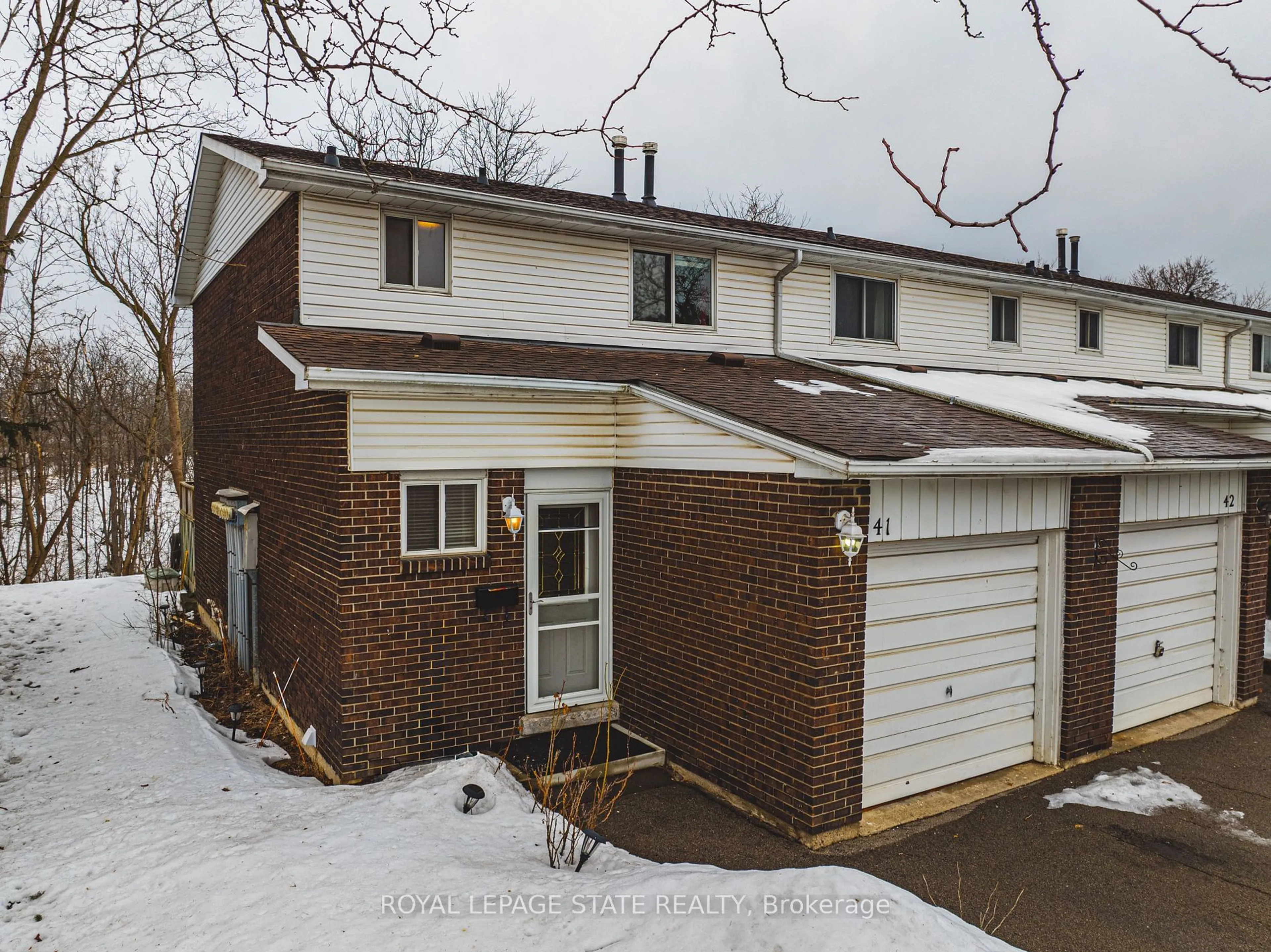 A pic from outside/outdoor area/front of a property/back of a property/a pic from drone, street for 100 Quigley Rd #41, Hamilton Ontario L8K 6J1