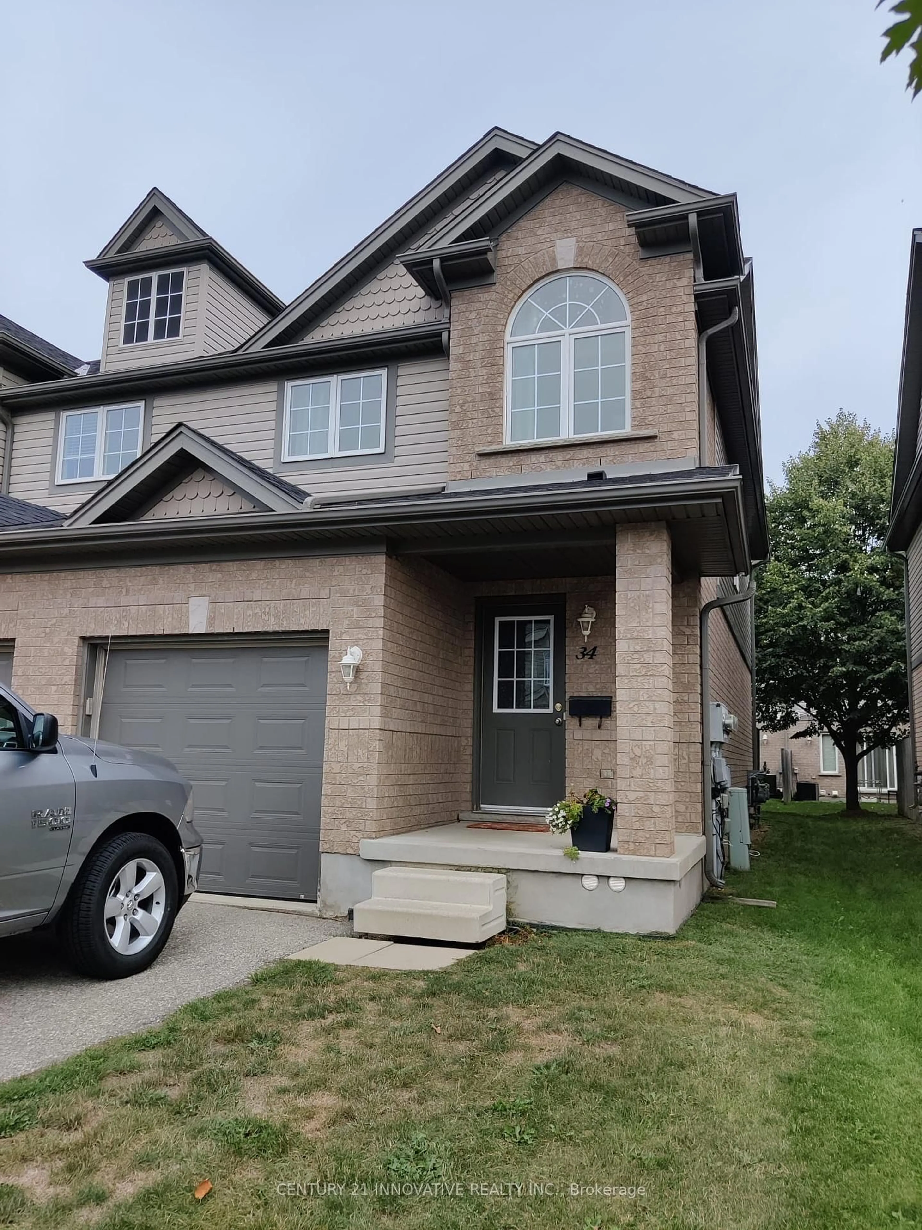 Home with brick exterior material, street for 34 Revell Dr, Guelph Ontario N1G 0B8